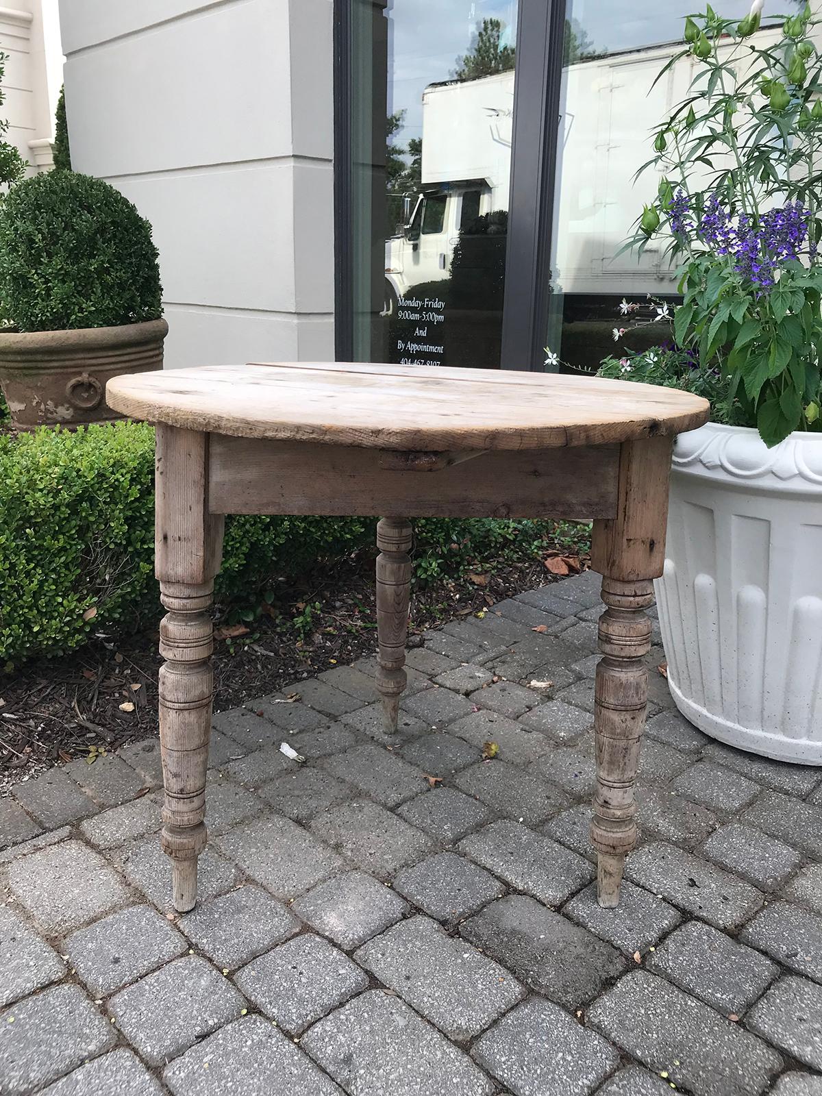 19th century round pine pub table with old bleached finish.