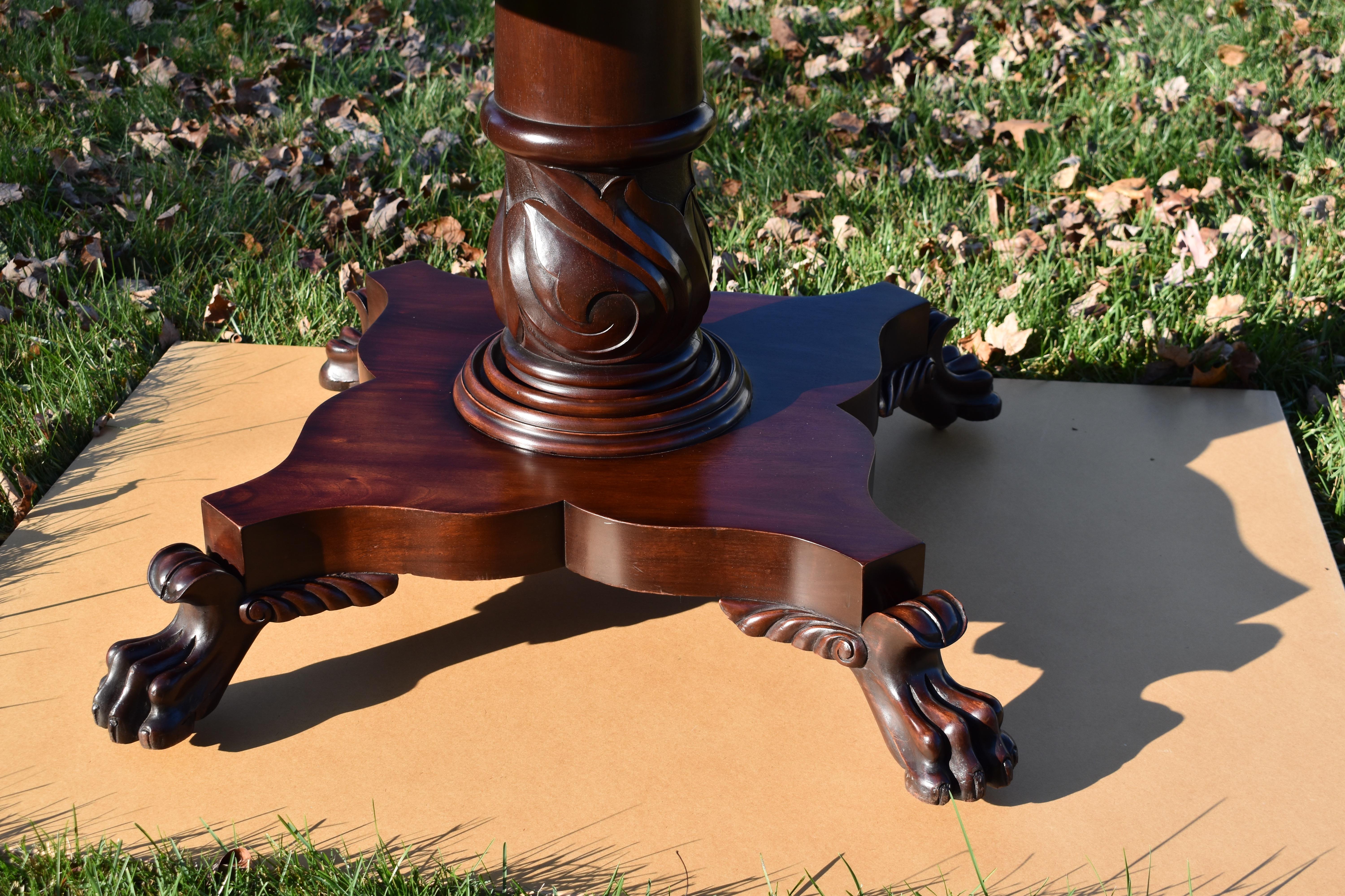 Hand-Carved 19th Century Round Regency Mahogany Table with Lion Paw Feet For Sale