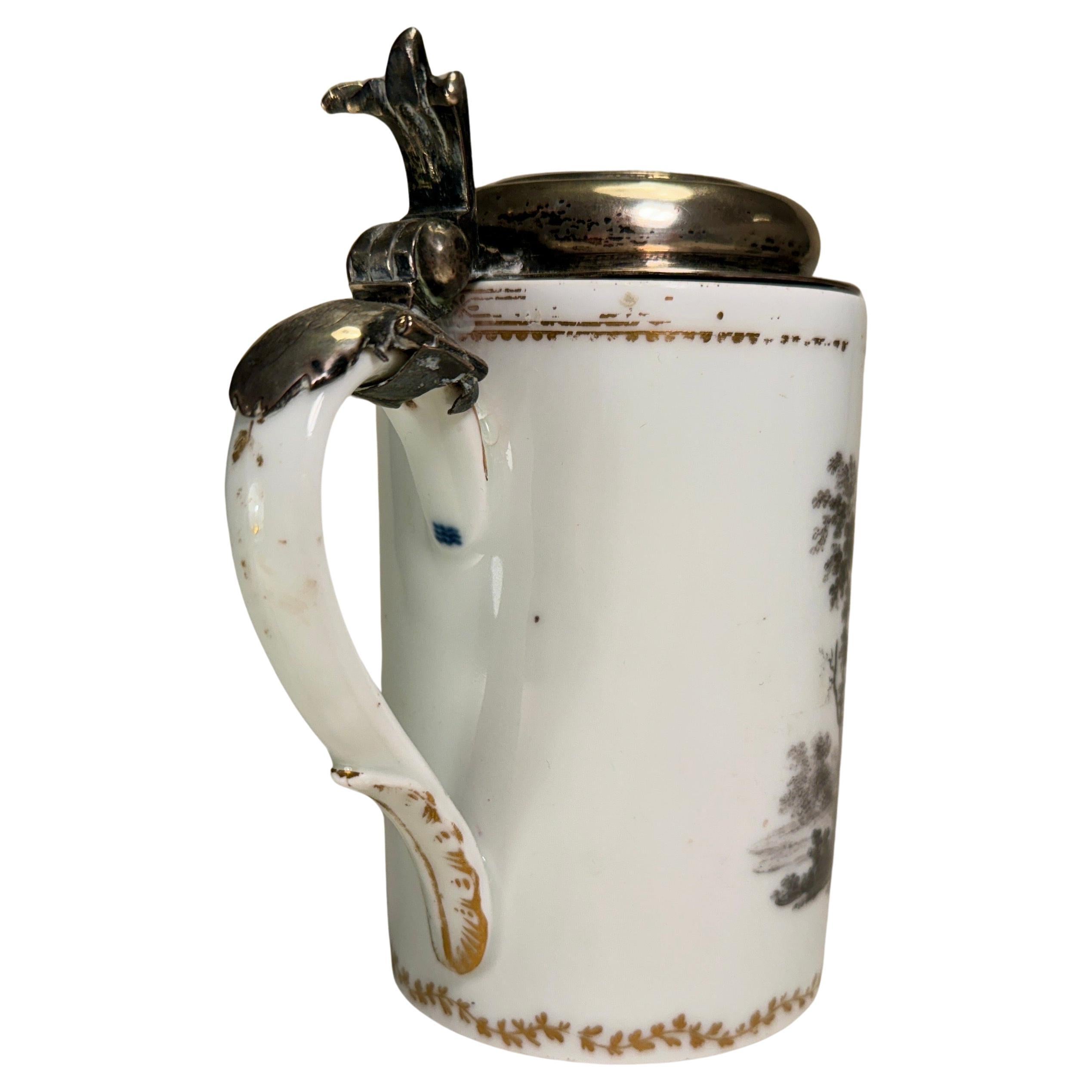 Danish Royal Copenhagen Porcelain Jug with Ormolu Gilt Silver Lid and Hand-Painted Neoclassical Motives in Sepia.
The porcelain jug is signed with the classic 3 blue waves, representing the 3 main water sounds and belts between the Baltics and the
