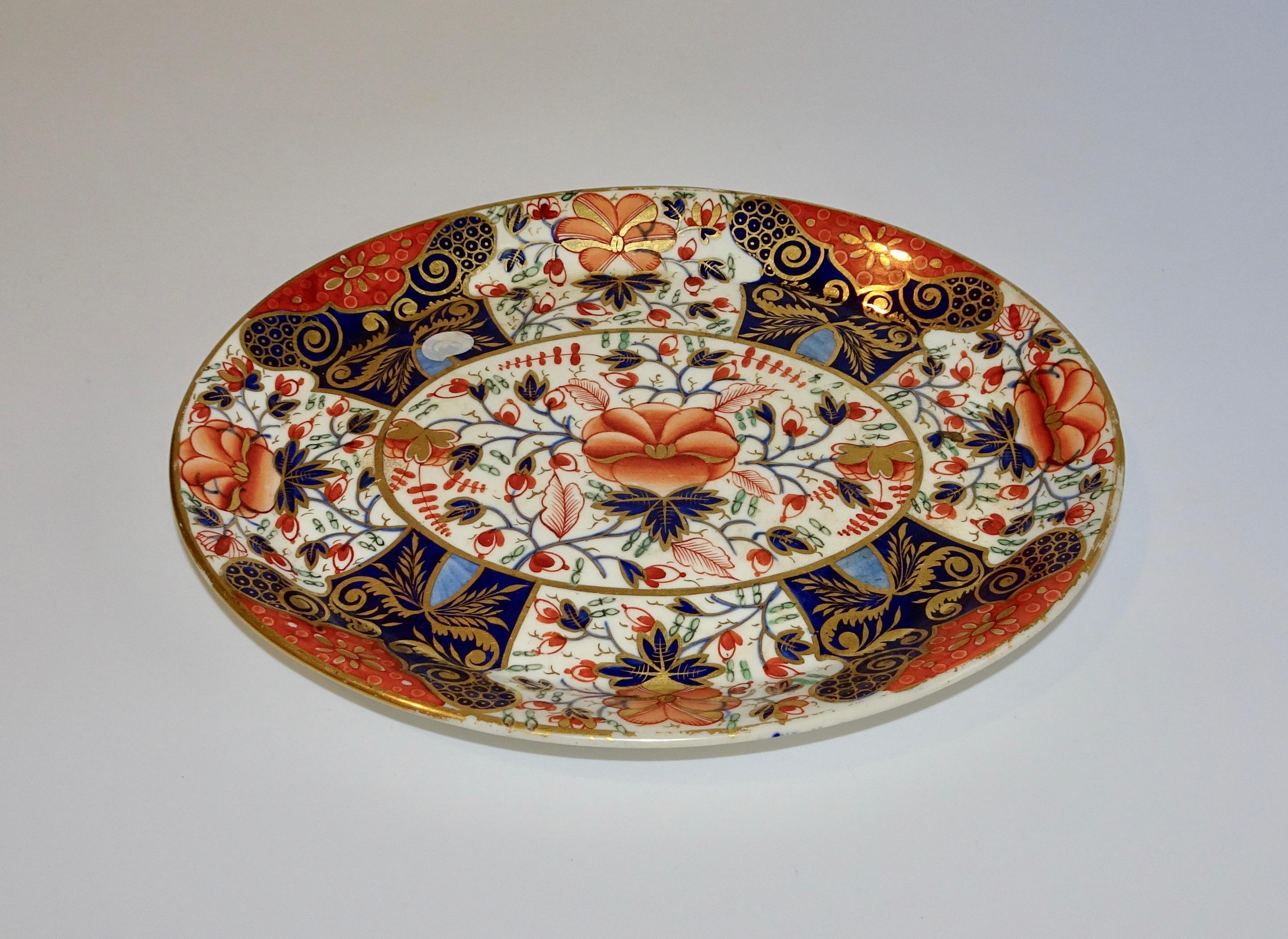 19th century Royal Crown Derby Porcelain Imari plate. The colors are blue, orange and gold.
