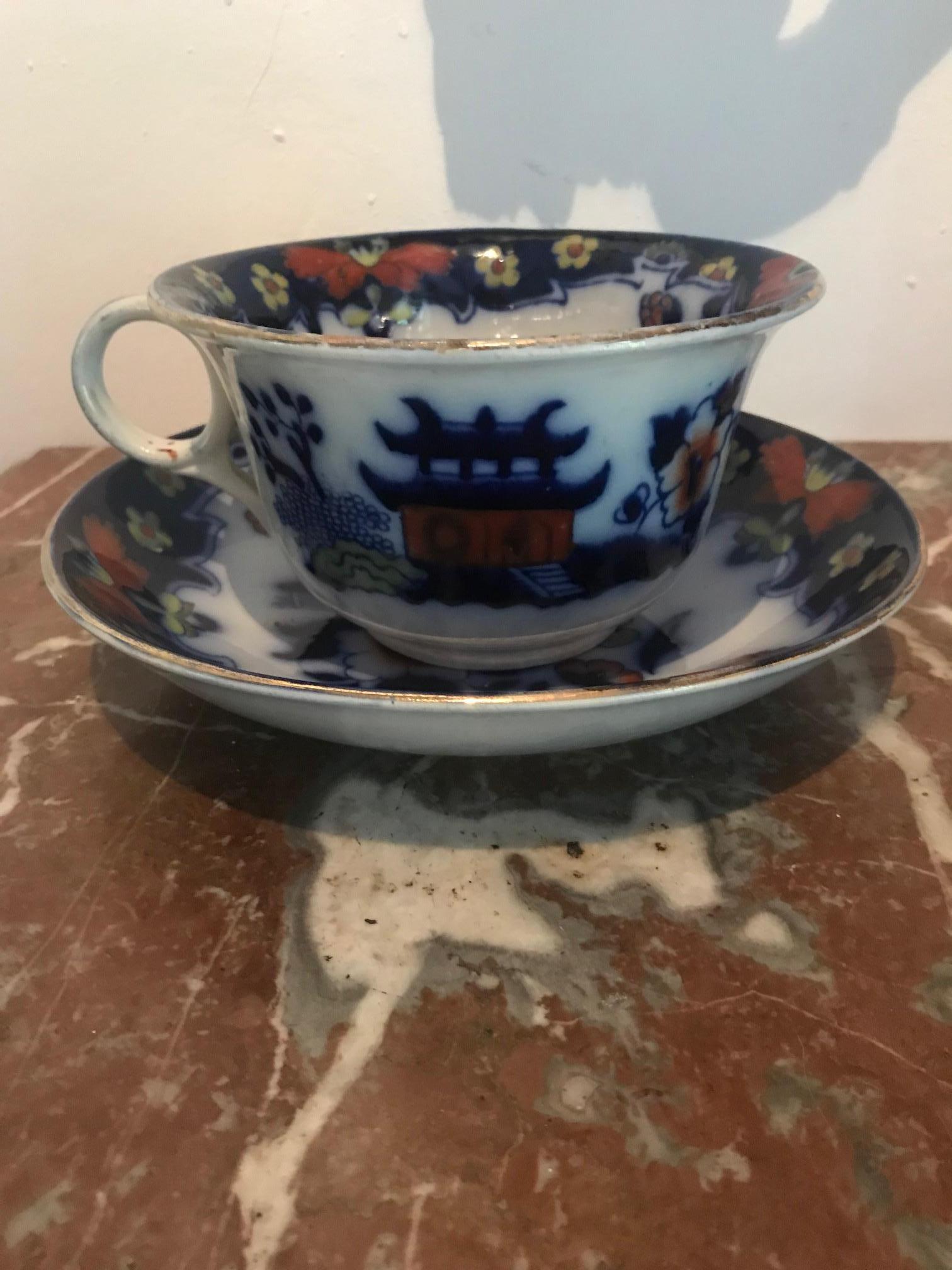 A large cup and saucer stamped with makers mark. Royal Staffordshire Pottery, Burslem England. Designed by Arthur J Wilkinson.