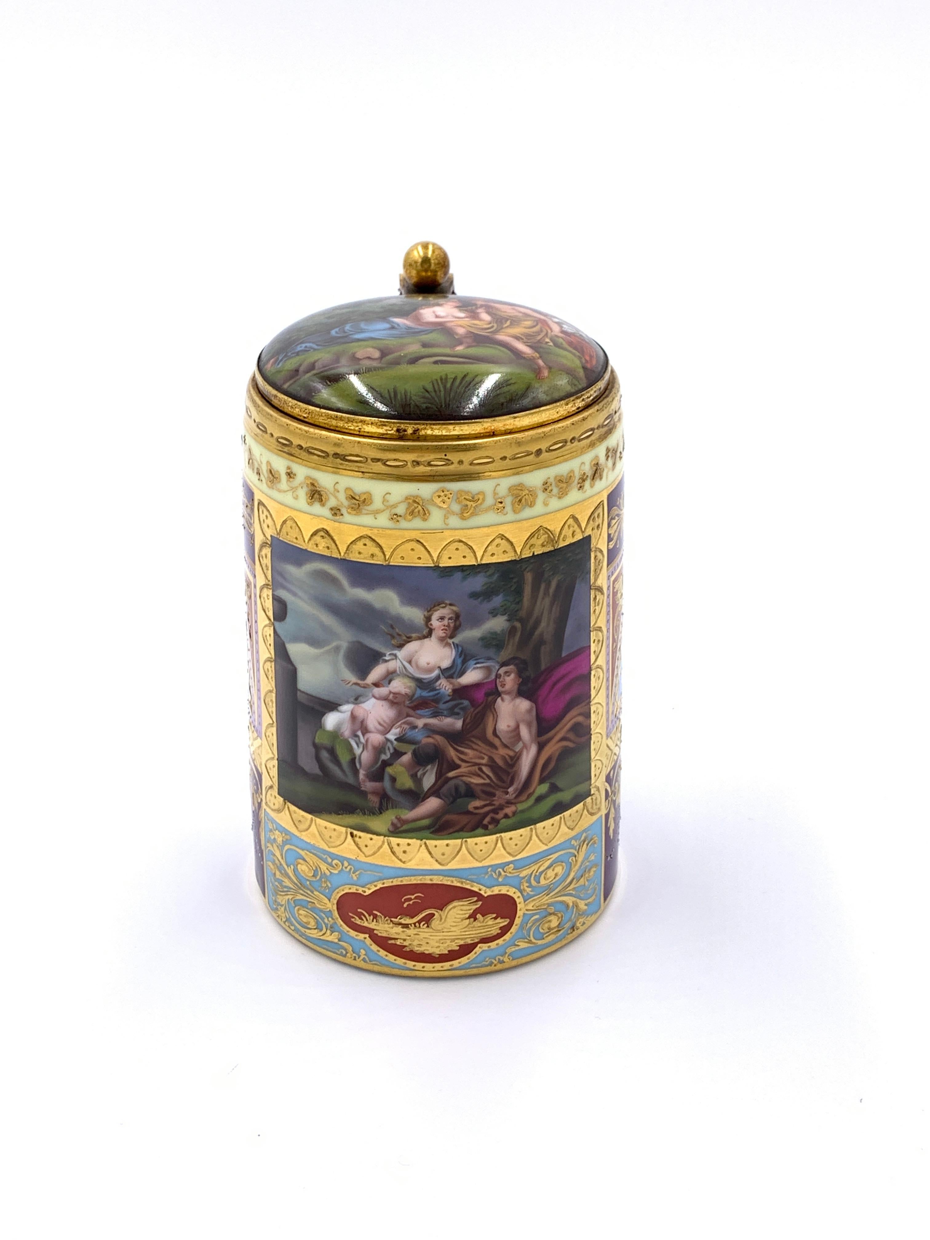 19th century royal Vienna porcelain lidded tankard, gilt metal in the shape of a ball above the handle and attached to the lid, decoration all around the out side and on the inner lid, blue beehive mark stamped on the base.
 