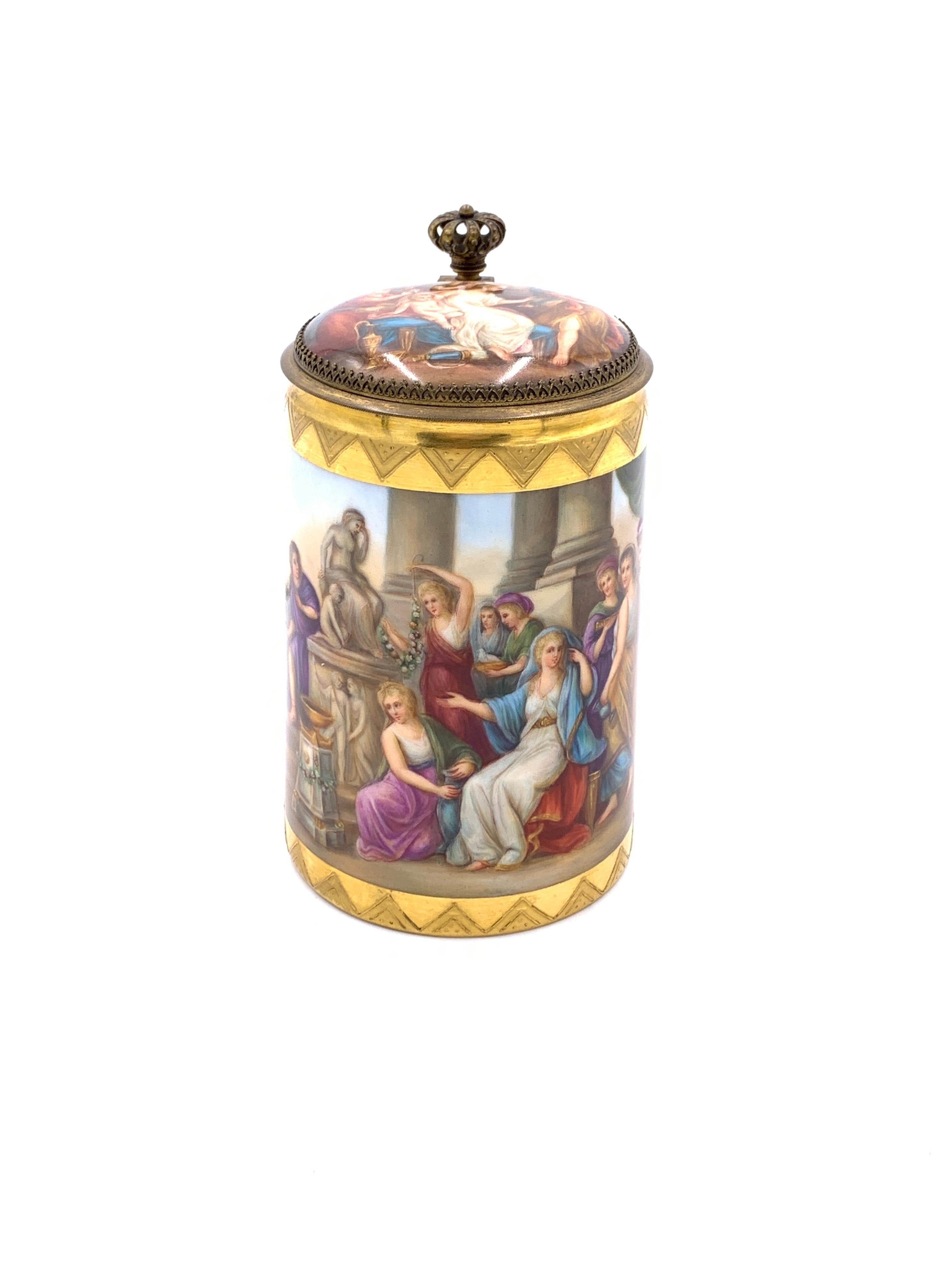 19th century royal Vienna porcelain lidded tankard, gilt metal in the shape of crown above the handle and attached to the lid, decoration all around the out side and on the inner lid, blue beehive mark stamped on the base.
 