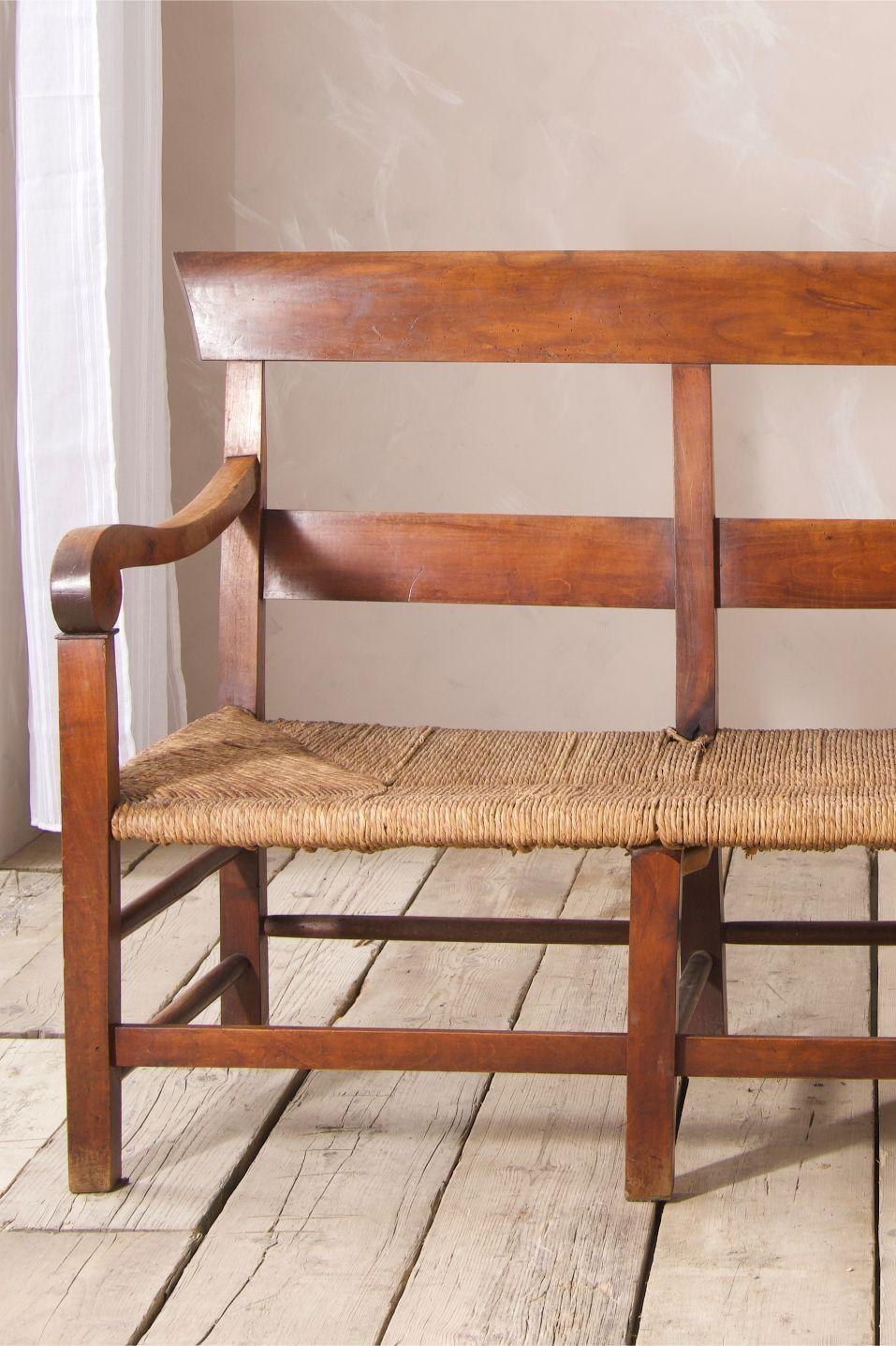 This is a very nice quality 19th century French rush seated hall bench. Original patina and age but good solid condition throughout and rush seat all in tact with just one loose thread. But doesn't effect the usability at all. Great size making it a