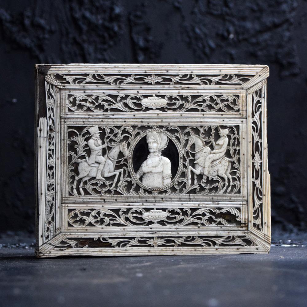 19th century Russian archangel carved whalebone box.

We are proud to offer a 19th century Russian archangel carved whalebone box decorated with lattice work floral acanthus leaf designs, and pine wooden base. Showing a man and women on horse back