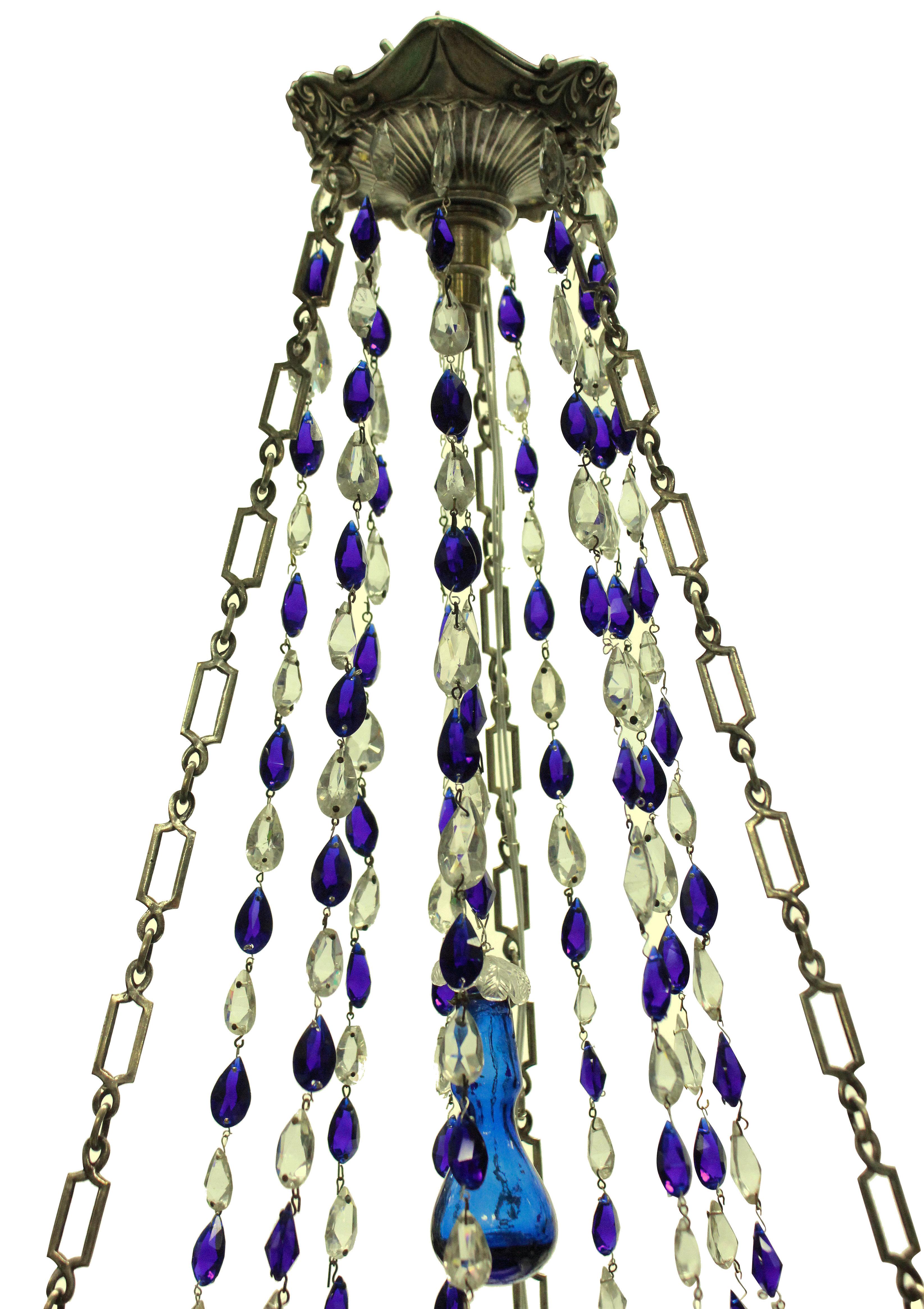 A charming 19th century Russian (Baltic) chandelier in silver with good quality cut glass drops and blue glass plate.
 
  