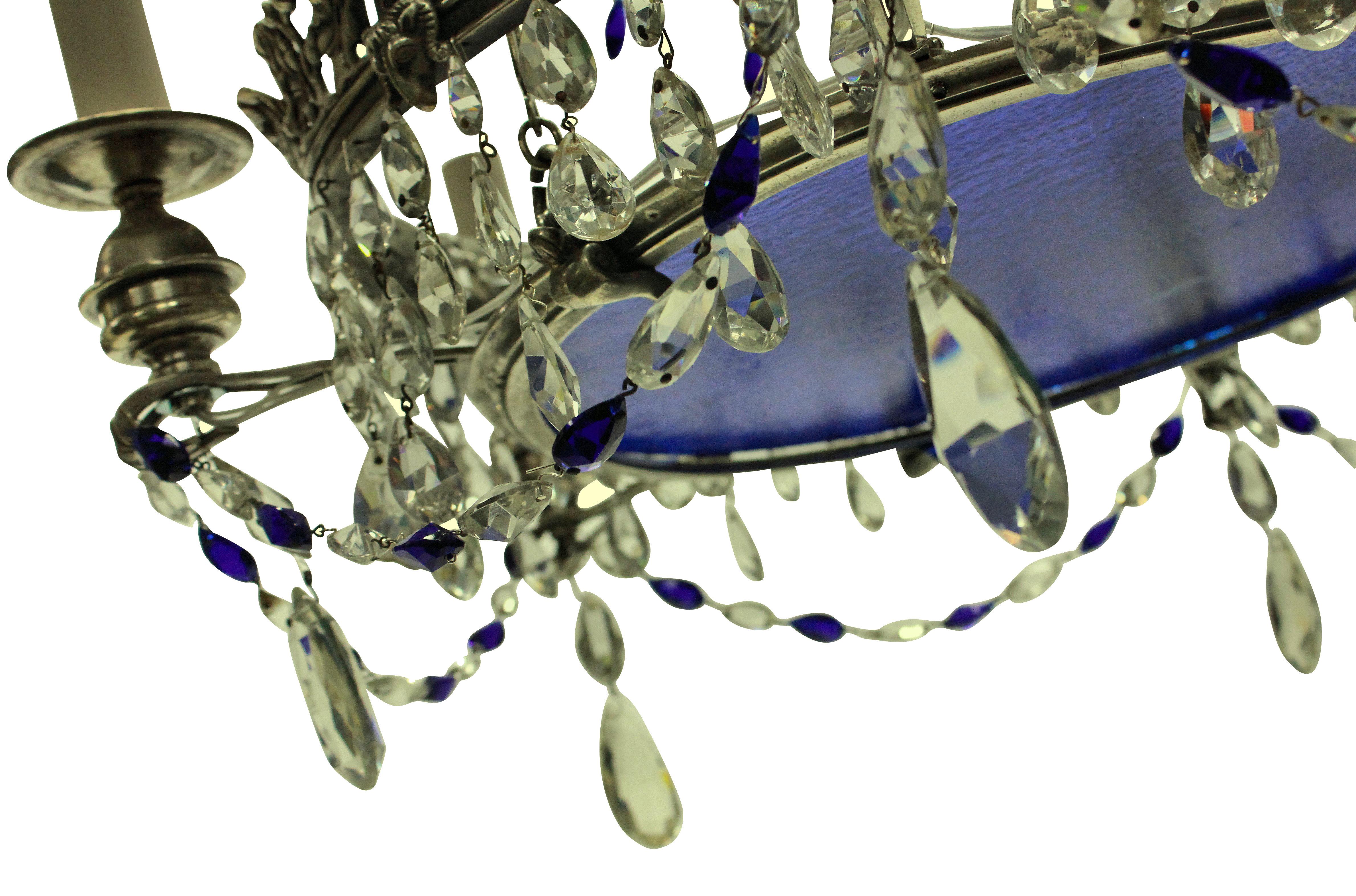 A charming 19th century Russian (Baltic) chandelier in silver with good quality cut-glass drops and blue glass plate.

