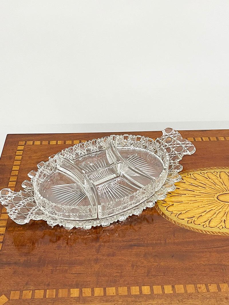 19th century Russian crystal cut set wit castellated rims

A dividing tray with 4 compartments and 2 dishes on a saucer. 
Russian cut crystal with castellated rims
Has very minuscule signs of use. 
This is a beautiful set of cut crystal made