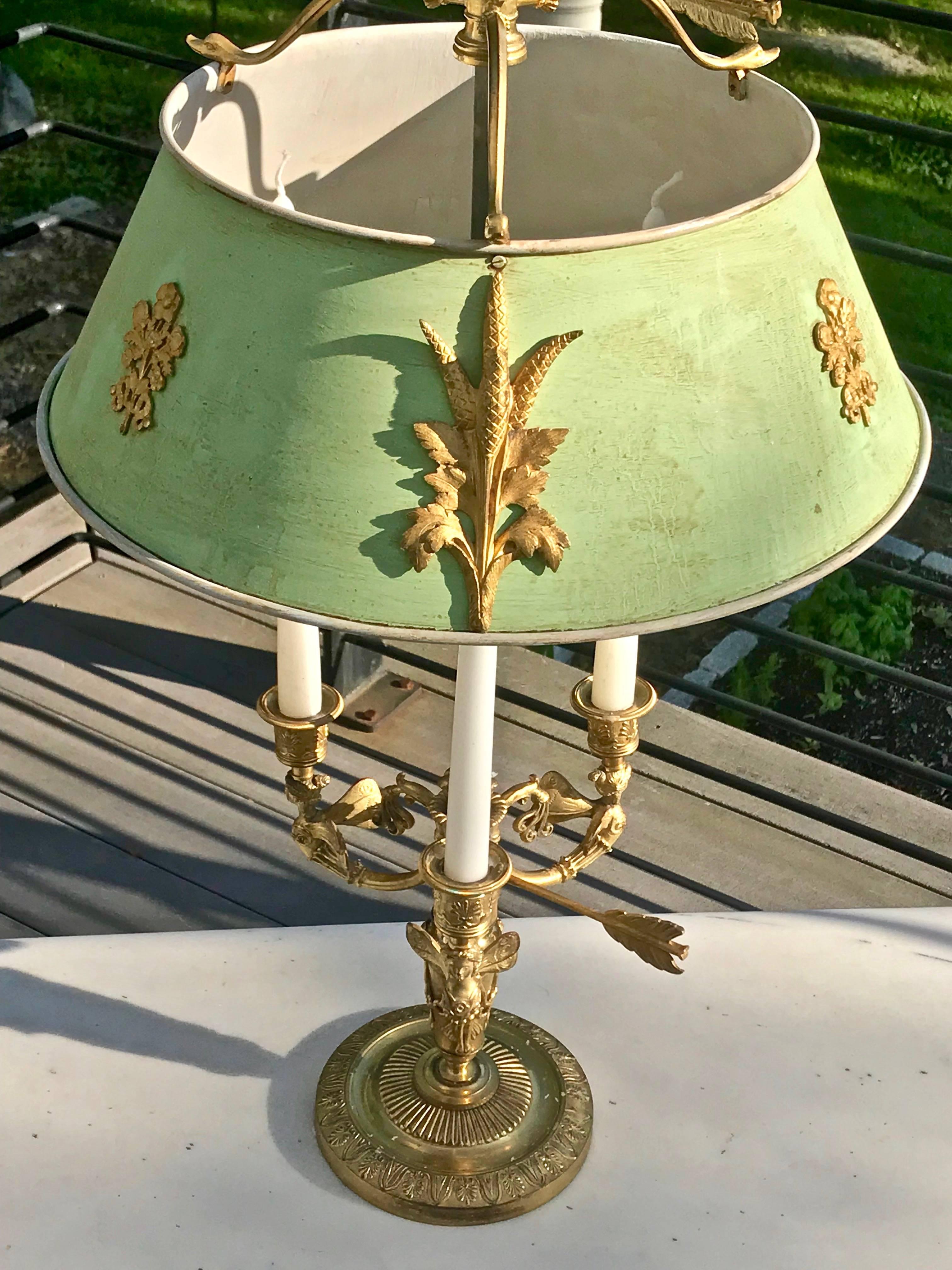 Incredible 19th century Russian Bouillotte lamp with ormolu fittings

--Winged Victory Finial
--Light green tole shade
--Zephyr motif
--Arrow to adjust heights
--Gilt bronze throughout

Ex Collection Middlebury College, VT.
  