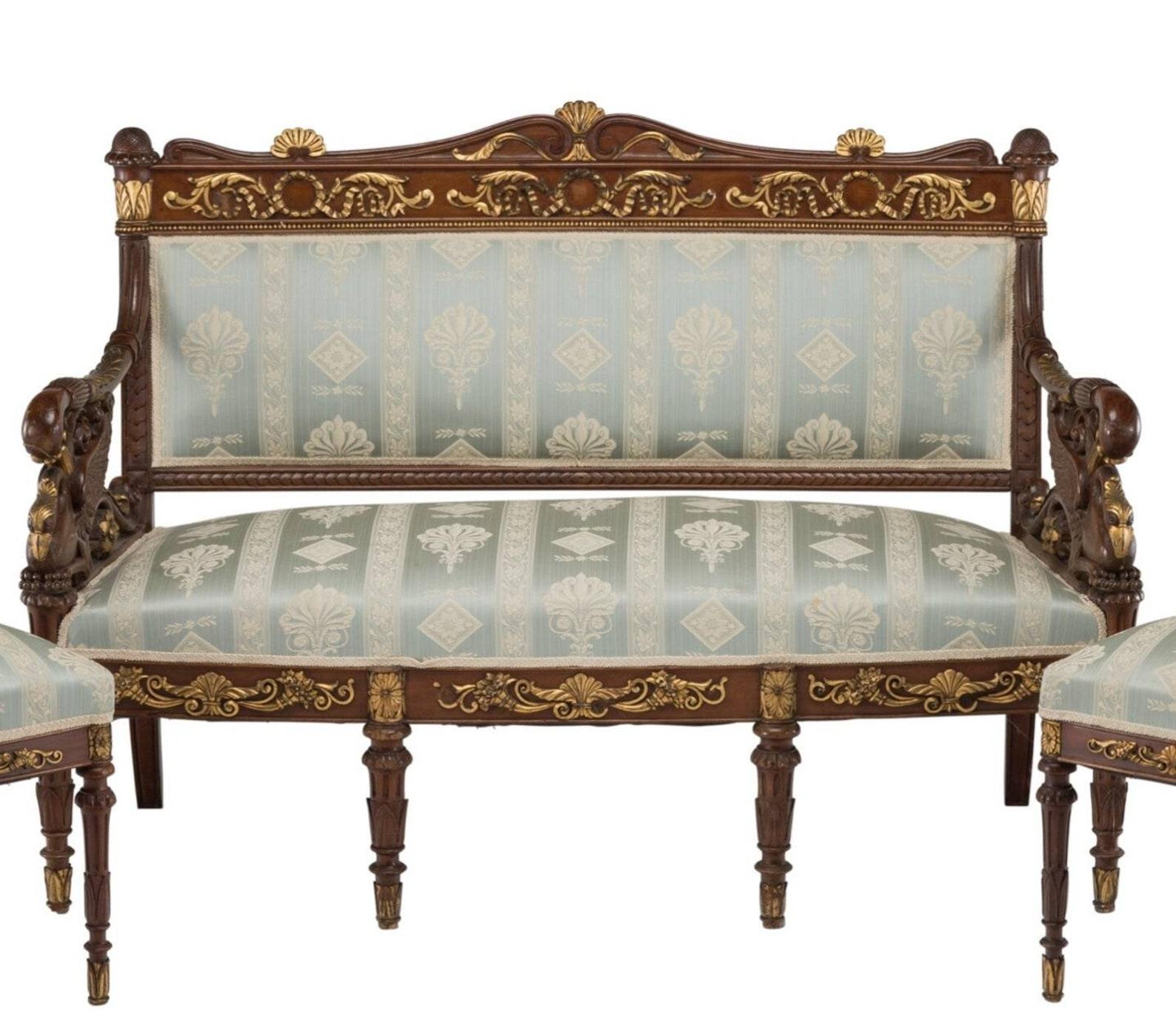 A rare and most impressive five-piece Russian neoclassical partial gilt carved wood upholstered salon suite.

Born in the 19th century, during the Russian Empire / Imperial Russia period, the suite comprised of four chairs and a settee, recently