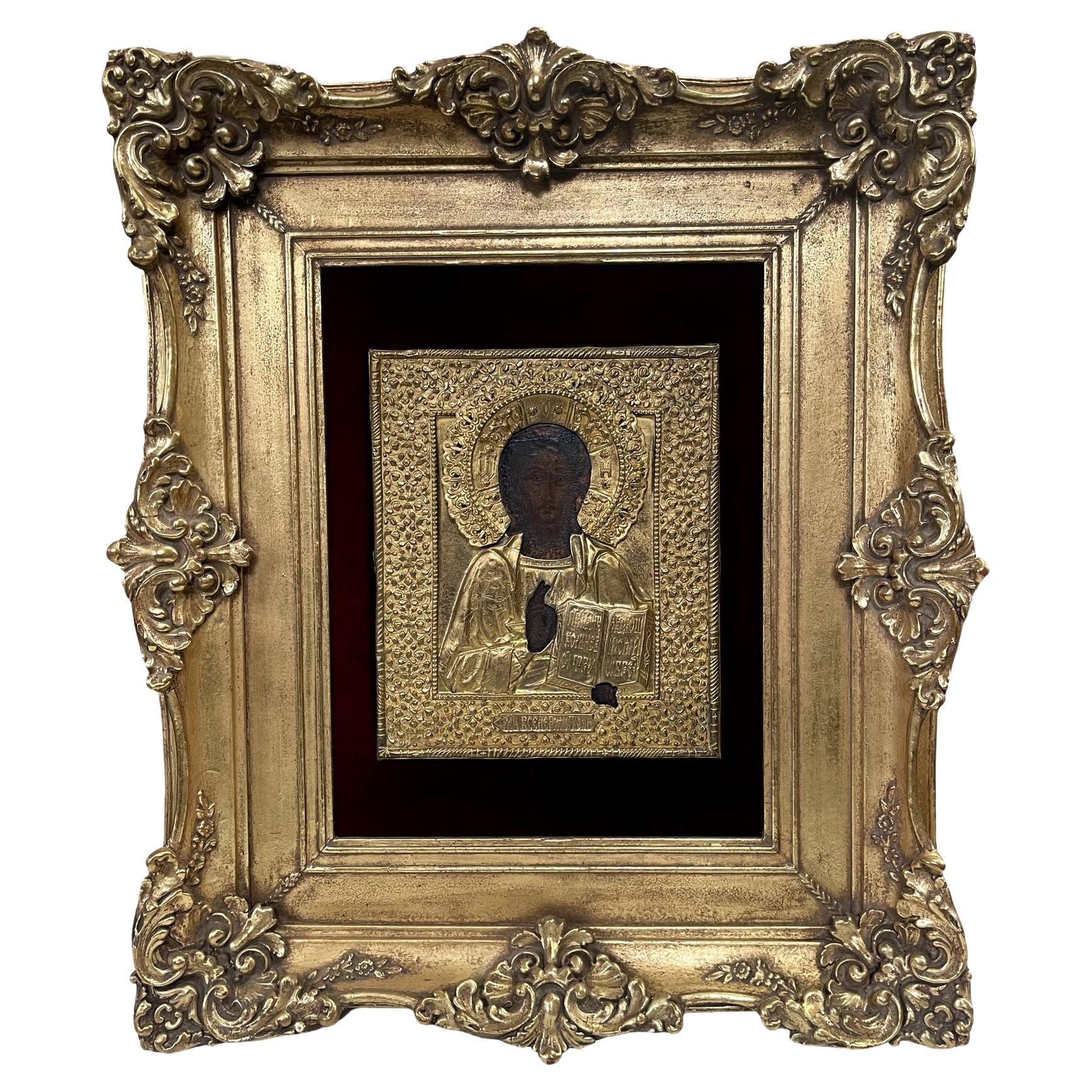 Icone russe del XIX secolo raffiguranti il Cristo Pantocratore con cornice in metallo dorato e dorata