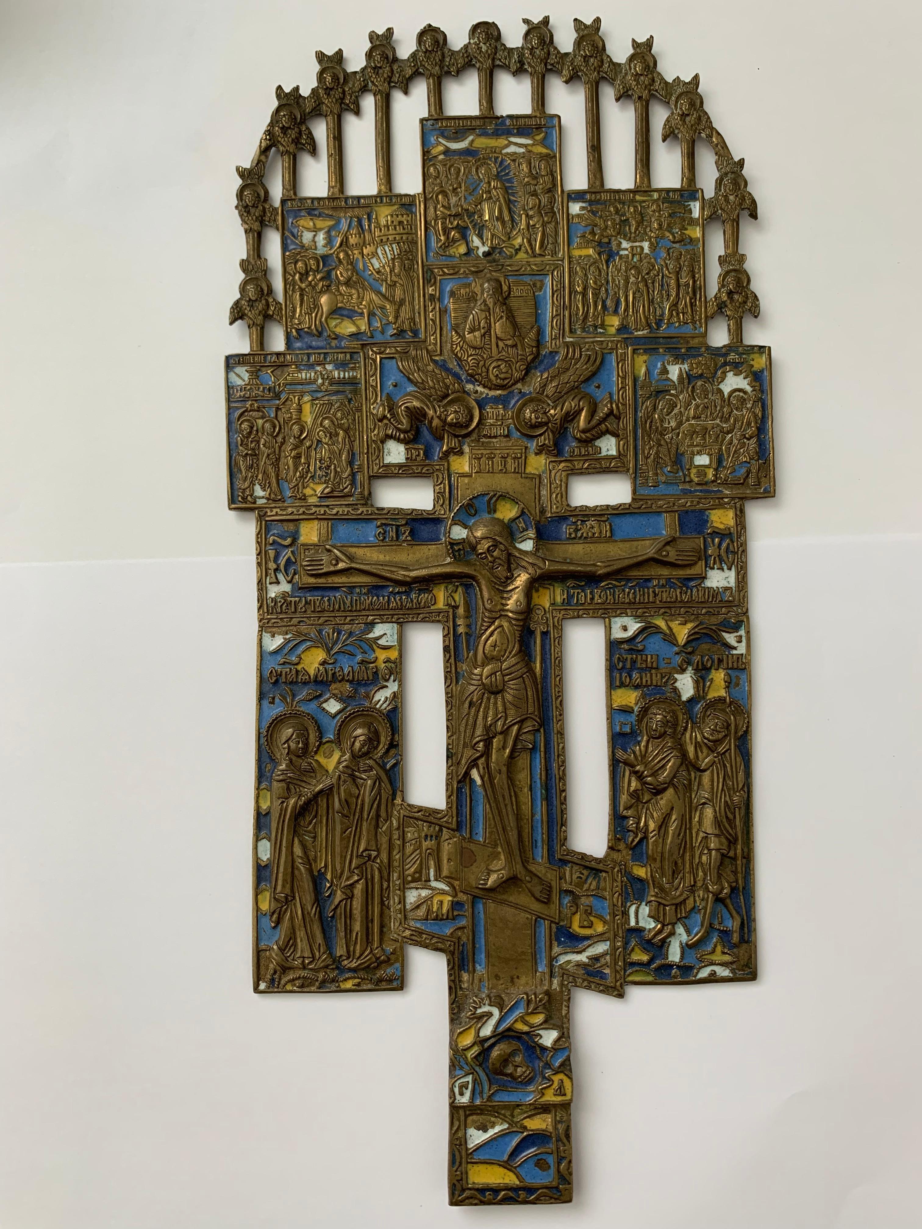 Wall or home cross.
Russian orthodox bronze and enamel cross.
Scene with Martha, Maria, Johannes, and Longinus underneath the cross and above the skull of Adam (symbol of overcoming death after the original sin)
Above god sabaoth between two