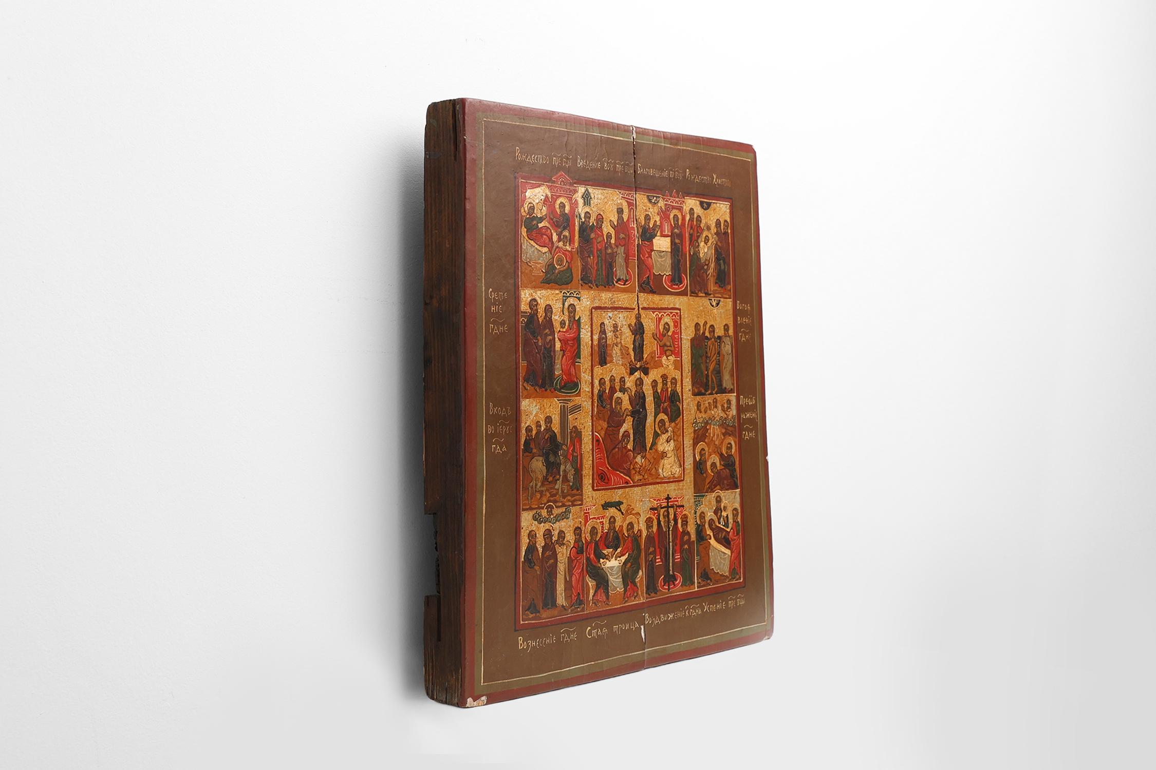 Bois Icône religieuse russe du XIXe siècle représentant les douze grandes fêtes, peinte à la main sur une feuille de papier. en vente