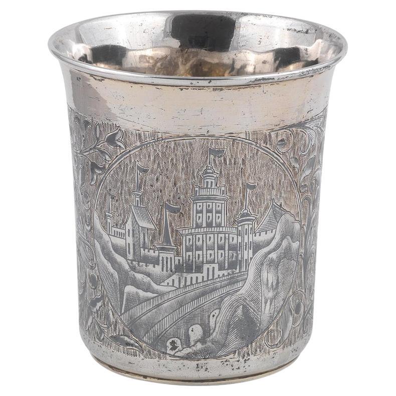 Maker's mark A.K., Moscow, 1844 tapering shape, sides nielloed with architectural panels and swags of flowers , all on a hatched linear ground 8.4cm high, 3.5oz. 