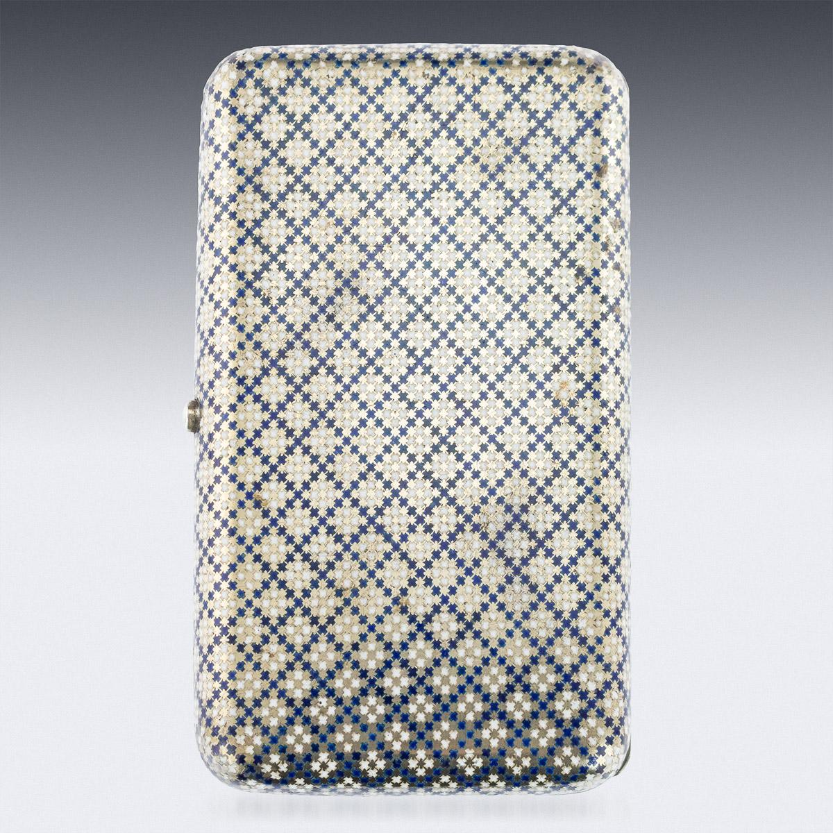 Antique 19th century Imperial Russian large solid silver and enamel cigar case, of rounded rectangular form, the surface enameled in opaque blue and white diaper, the lid engraved with a vacant cartooche within scalloped foliate borders, the
