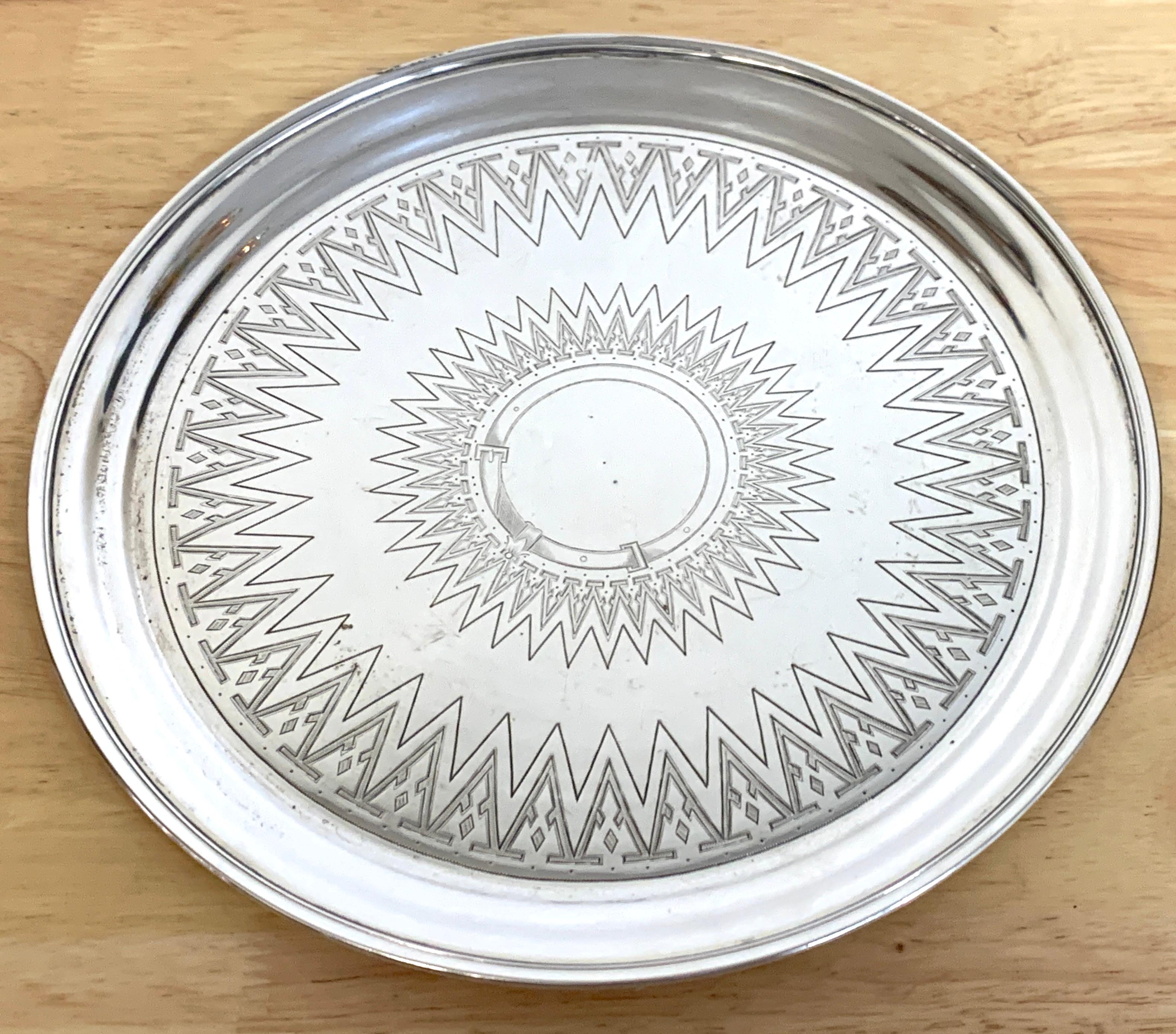 19th century Russian silver engraved salver, 1879
With beautiful intricate bright decoration, with center belt motif cartouche
Numerous hallmarks, weighs 15.6 Troy Ounces.