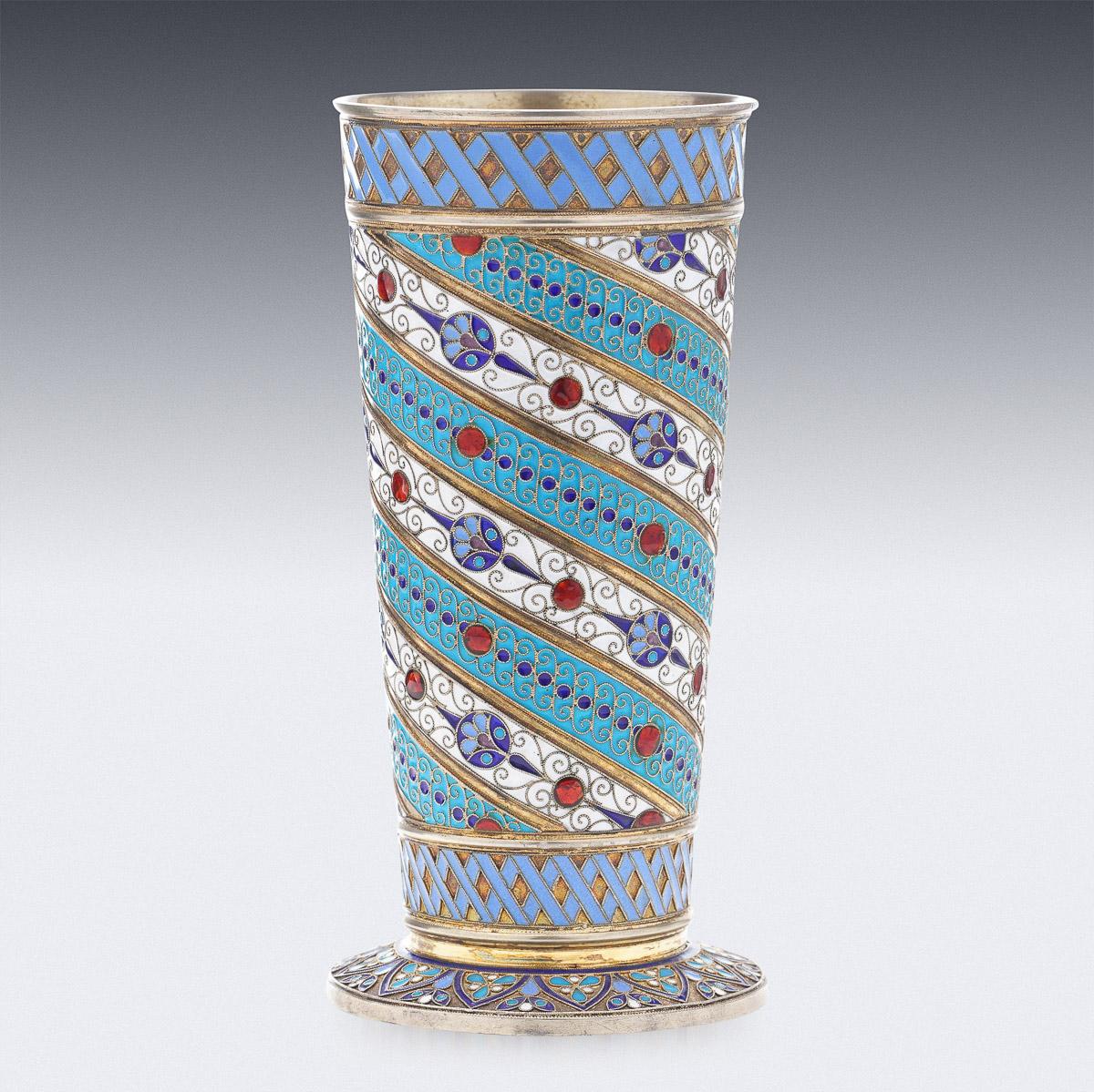 19th Century Imperial Russian silver-gilt & cloisonné enamel beaker, designed upright with a spreading foot, the body profusely decorated with floral motifs in vary-coloured cloisonné enamel within cross-hatch borders boarders.
Hallmarked Russian