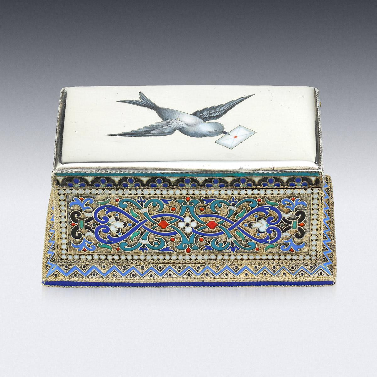 19th century Russian silver and hand painted champleve enamel stamp box, the lid depicting a bird carrying a letter in its beak, all side decorated with stylised floral design, the inside of the box is richly parcel gilded. Hallmarked Russian silver