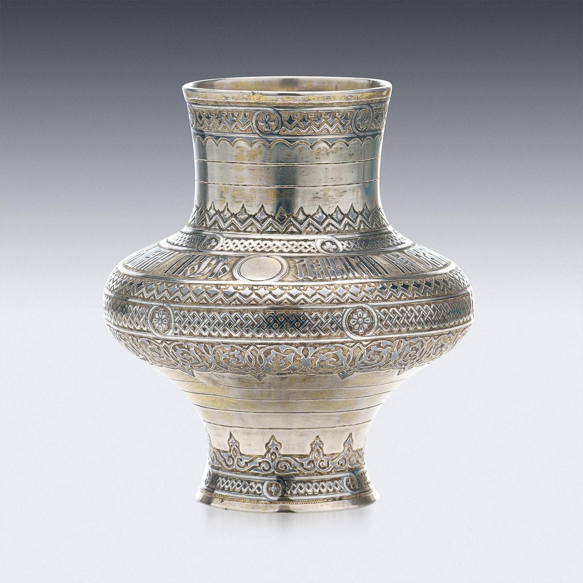 19th Century Russian silver-gilt trompe l'oeil kvas jug, of heavy gauge, of traditional form, applied with a plain handle and elaborately decorated with Pan-Slavic motives, applied with niello enamel and partialy gilt.
Hallmarked Russian Silver 84