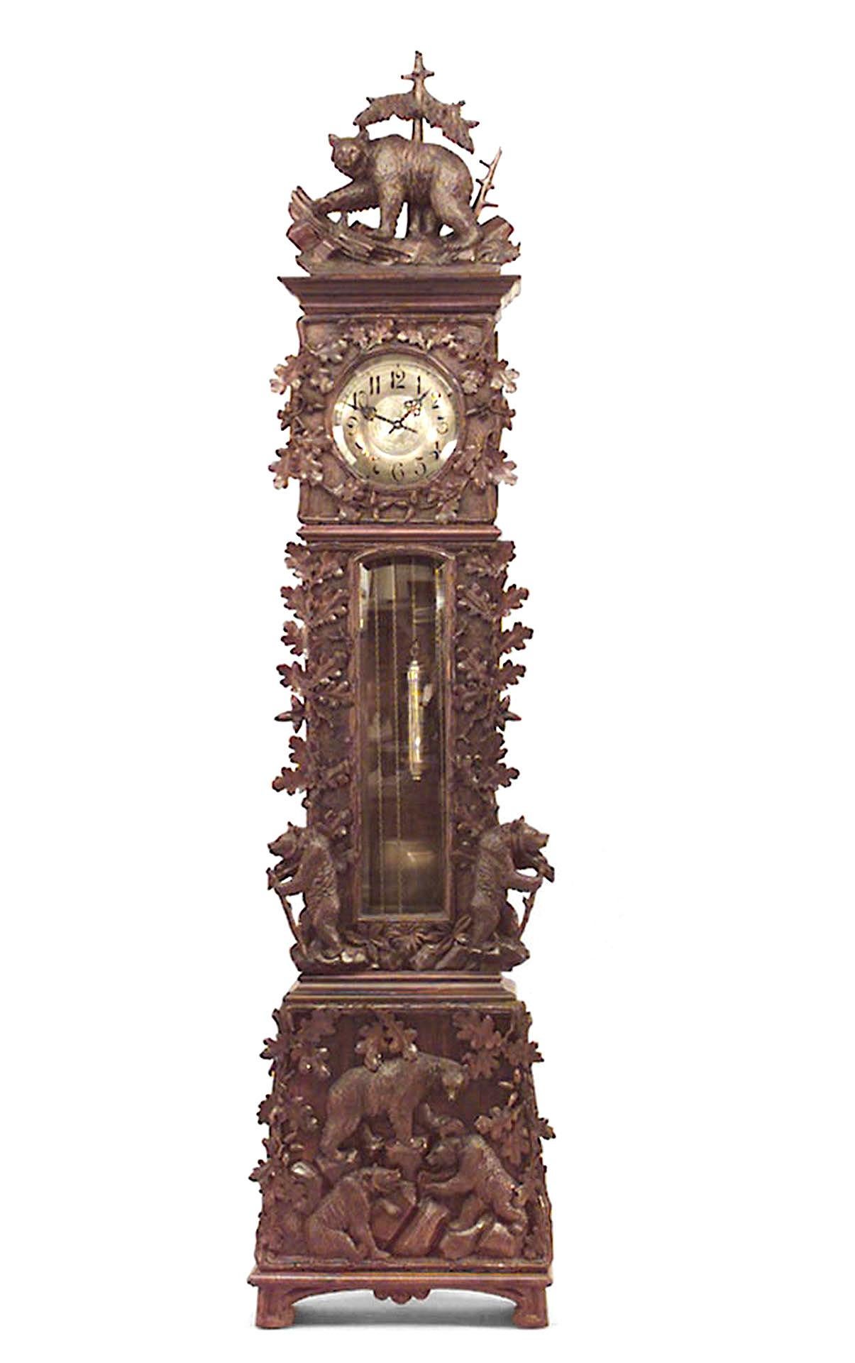19th century rustic Black Forest grandfather clock composed of walnut elaborately carved with oak leaves and bears in high relief (Non-operational).