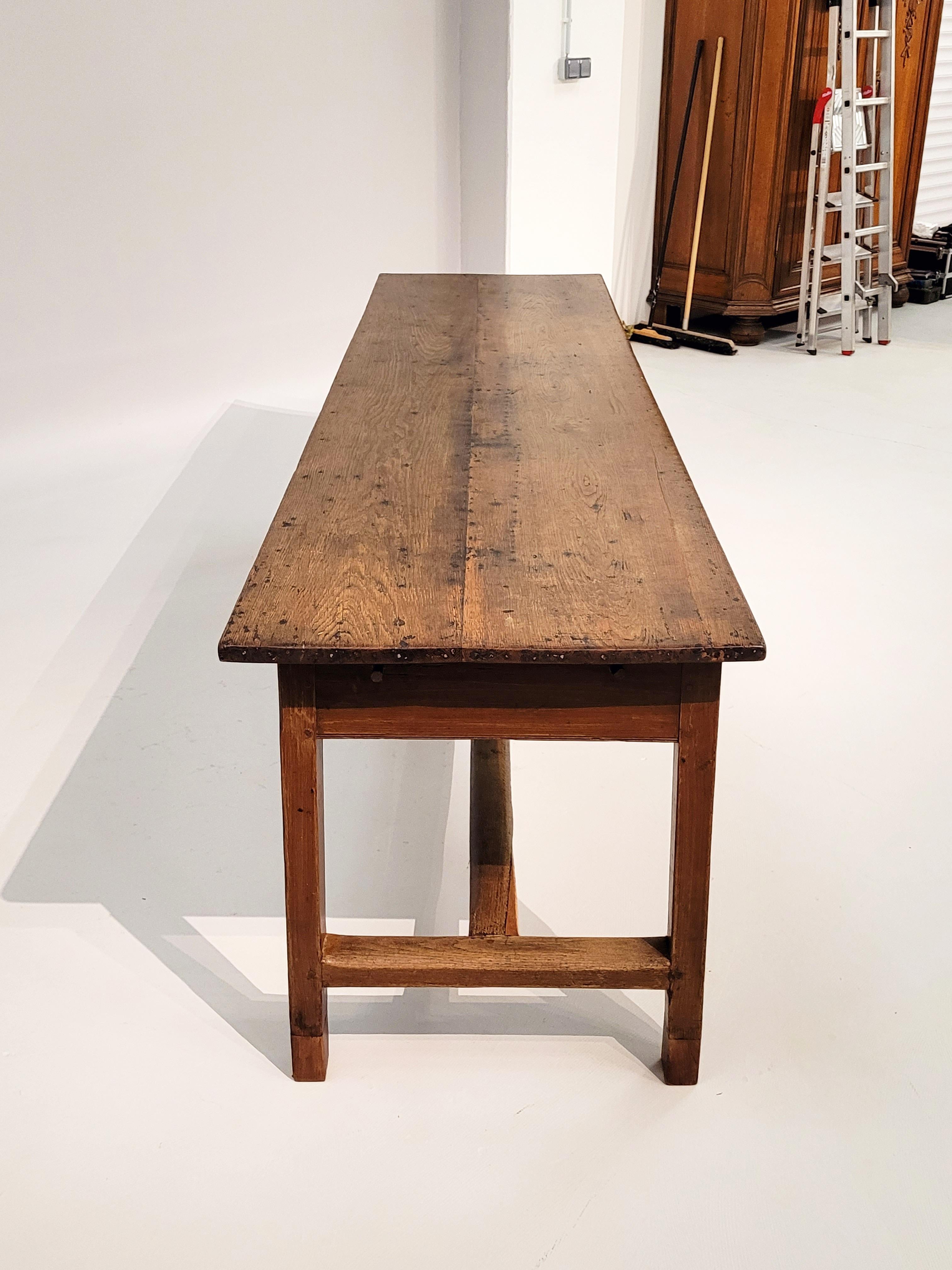 Antique brewery table

North Germany
Oak
19th century

Dimensions: H x W x D: 77 x 263 x 68 cm

Description:
Long and narrow brewing table made of solid oak with wonderful signs of age and patina. Optimal for 8-10 persons.

The base is
