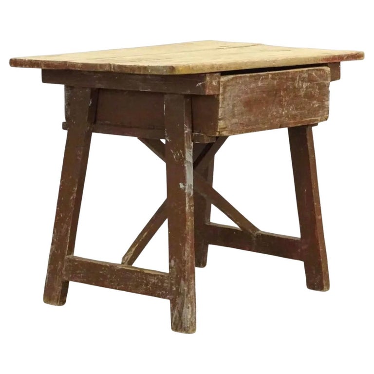 19th century low rustic country single drawer side or work table. Table has wonderful aged character. It can be used as an end table or coffee table in a rustic decoration but also it could be the used as an accent combined with midcentury pieces in