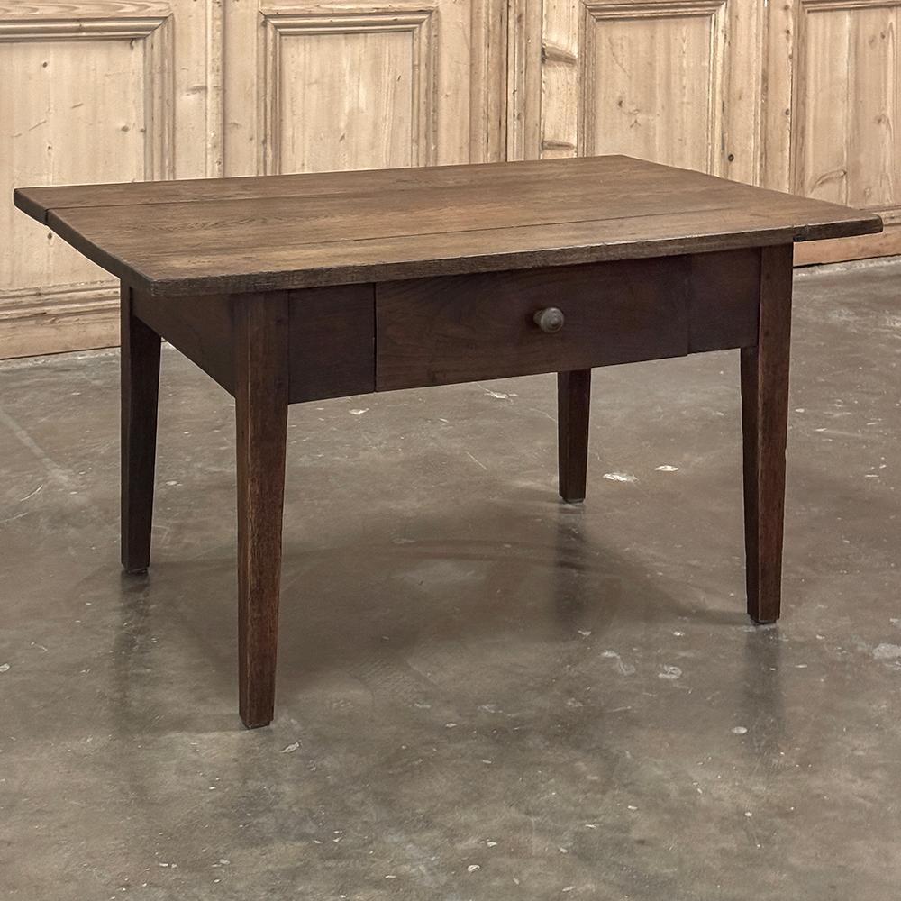 19th Century Rustic Country French Coffee Table is a classic, no-nonsense piece of furniture that your family can use every day for generations! Hand-crafted from planks of solid old-growth oak and elm wood, it features a plank top over an apron