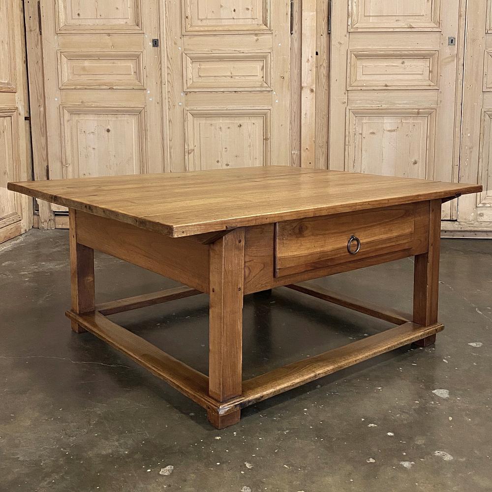 19th Century Rustic Country French Fruitwood Coffee Table is a charming ode to the bygone era of lovingly hand-crafted furnishings being the norm, not the exception! Utilizing old-growth fruitwood from trees that no longer bore fruit, the artisans