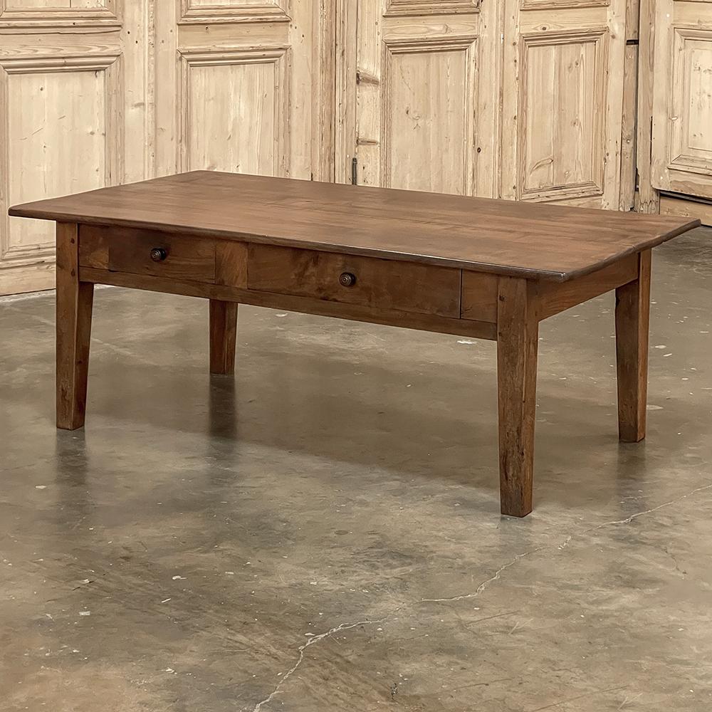 19th Century Rustic Country French Walnut Coffee Table is a timeless example of hand-crafted techniques that have been handed down from generation to generation for centuries!  Utilizing exquisite French walnut, the artisans chose two large planks