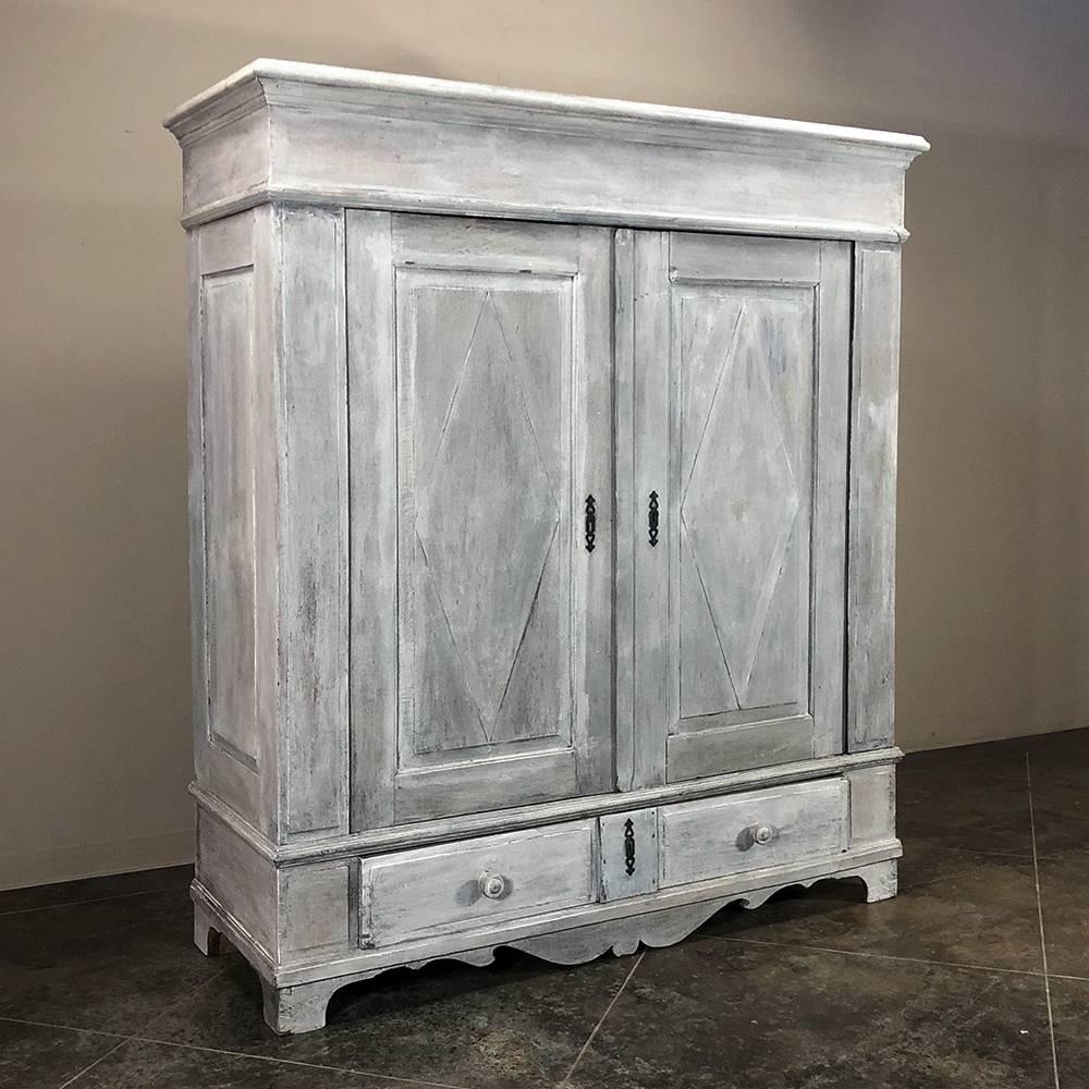 19th century stately rustic Dutch white painted armoire with grey patina was literally designed to last for centuries and features tailored lines and a wonderful distressed painted finish that is perfect for today's casual decors. Doors open wide to