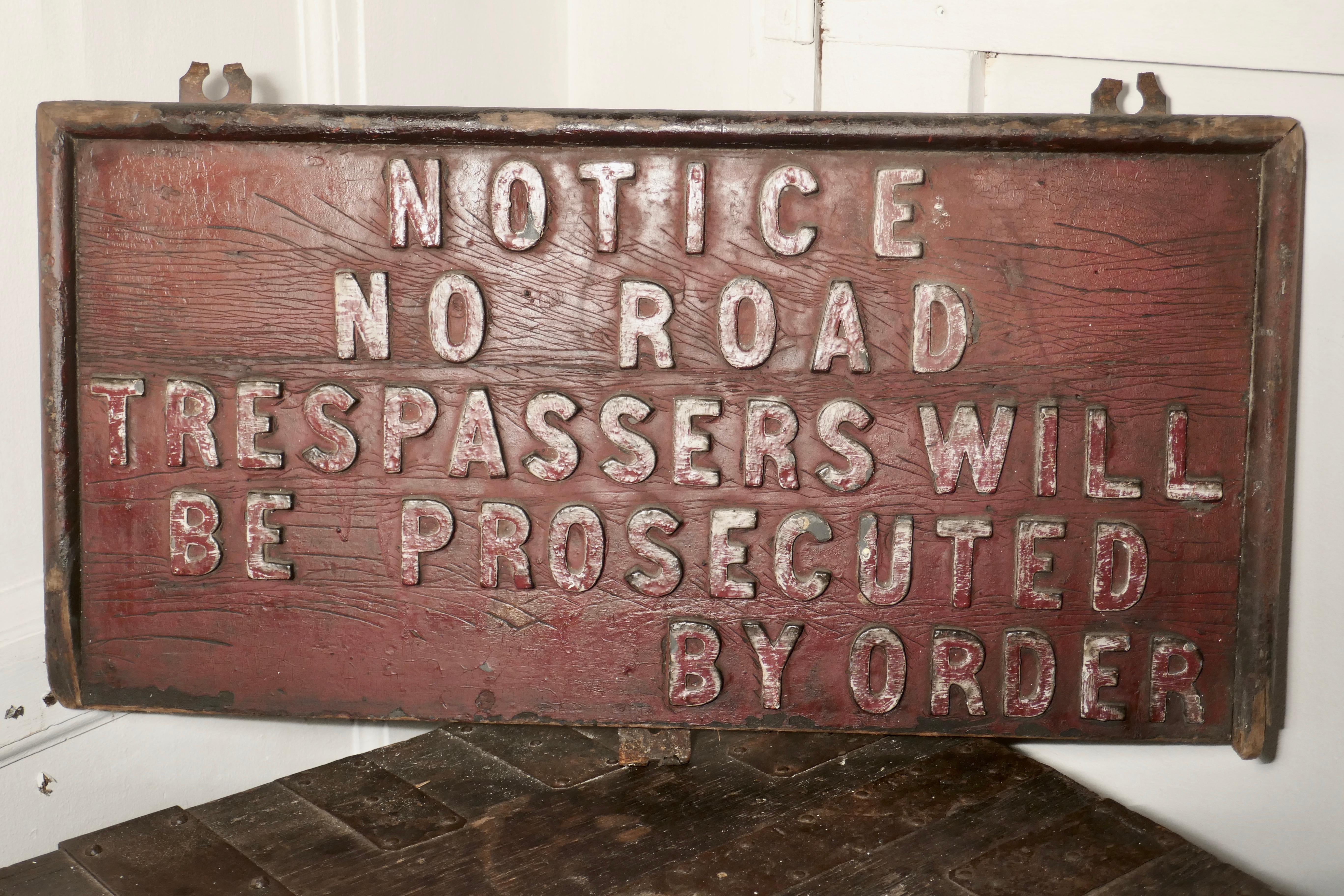 19th century rustic private land owners trespassers sign

This sign is made in elm with metal lettering set in relief it says

Notice
No road
Trespassers Wil
Be prosecuted
By order

The sign is in sound weathered condition, it is 13” high,