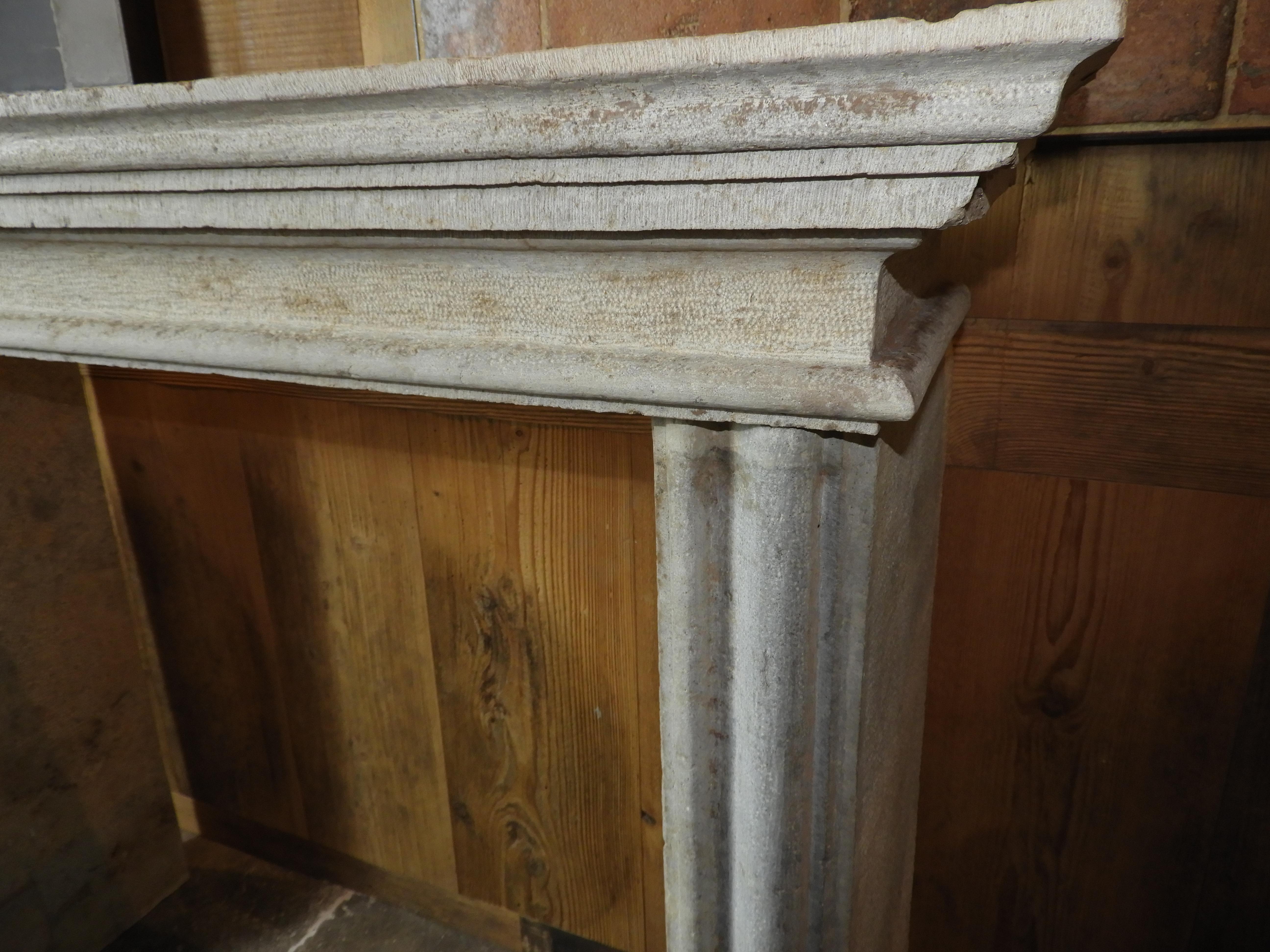 19th century, French limestone bush hammered an chiseled fireplace with an interior size of 106.5 cm wide x 102 cm high.

