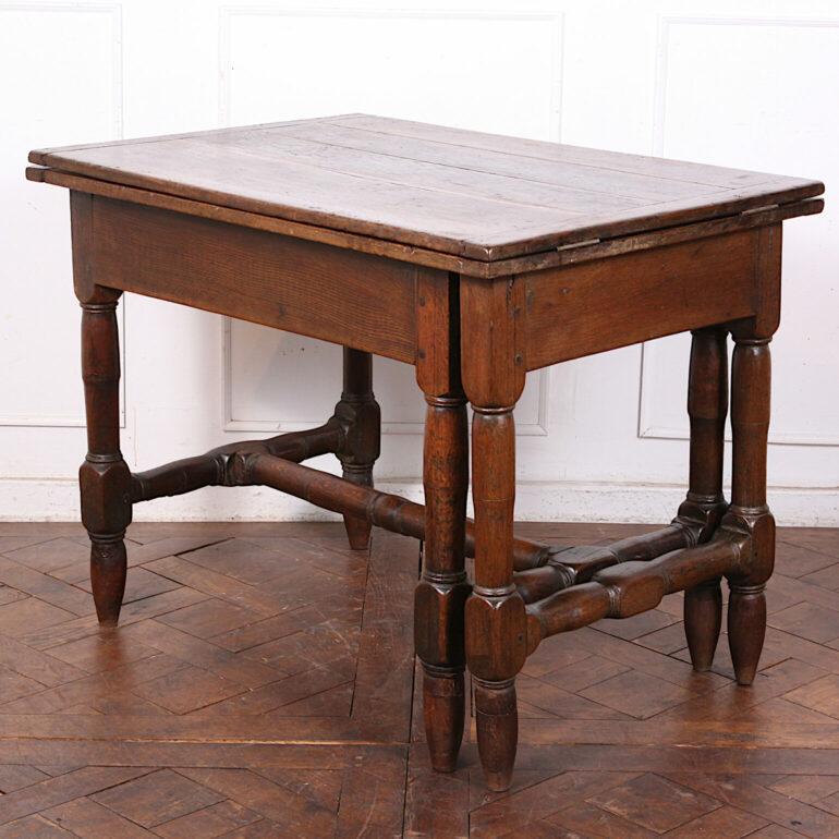 Unusual French rustic oak extending farm table, the base with pull-out legs to allow the top to open up and double in length. 

Measures: 40? wide x 27.5? deep x 31? tall x 80.5? extended.

 