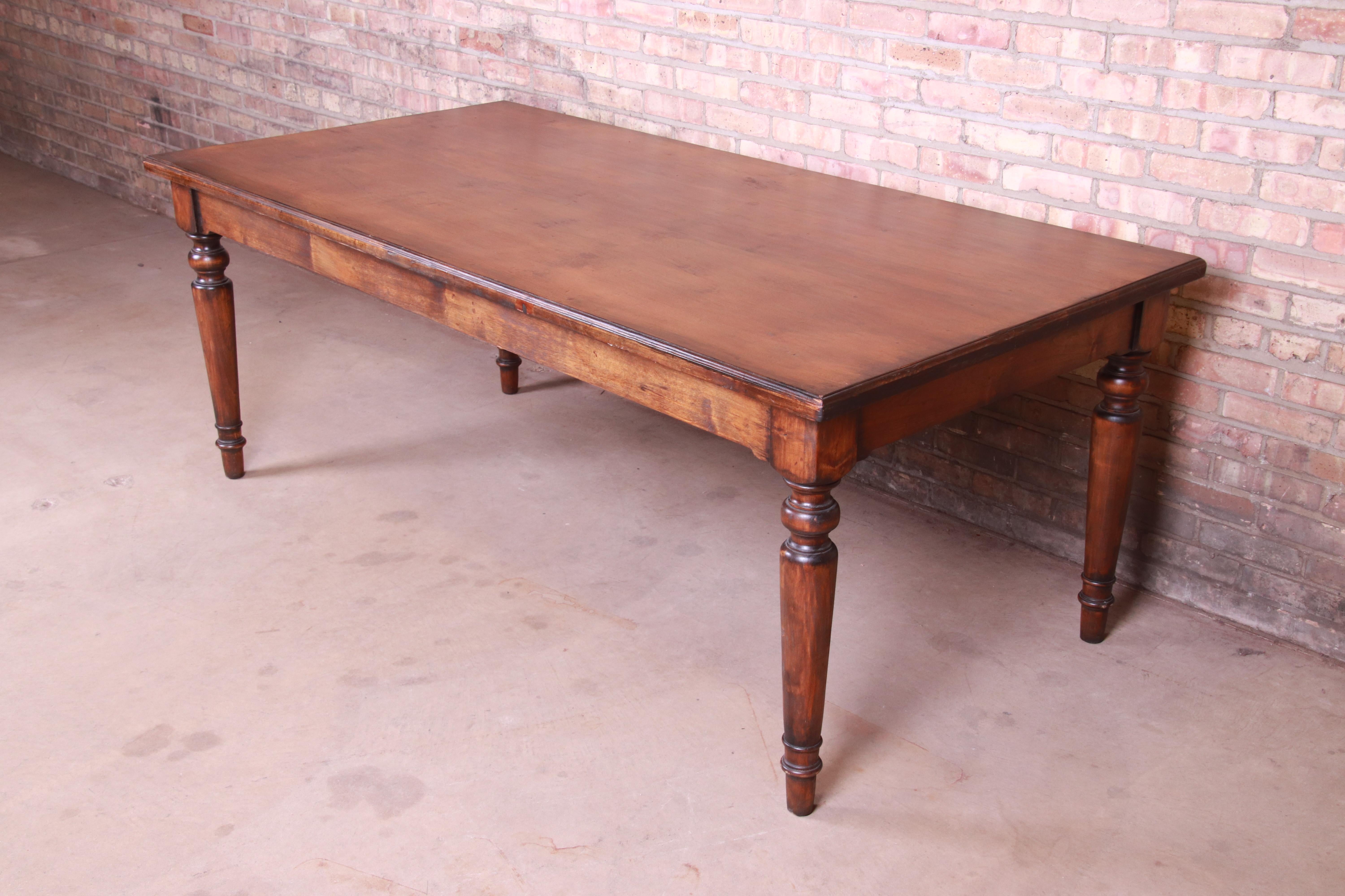 A gorgeous antique primitive solid pine harvest farm table with turned legs

France, 19th century

Measures: 78.5