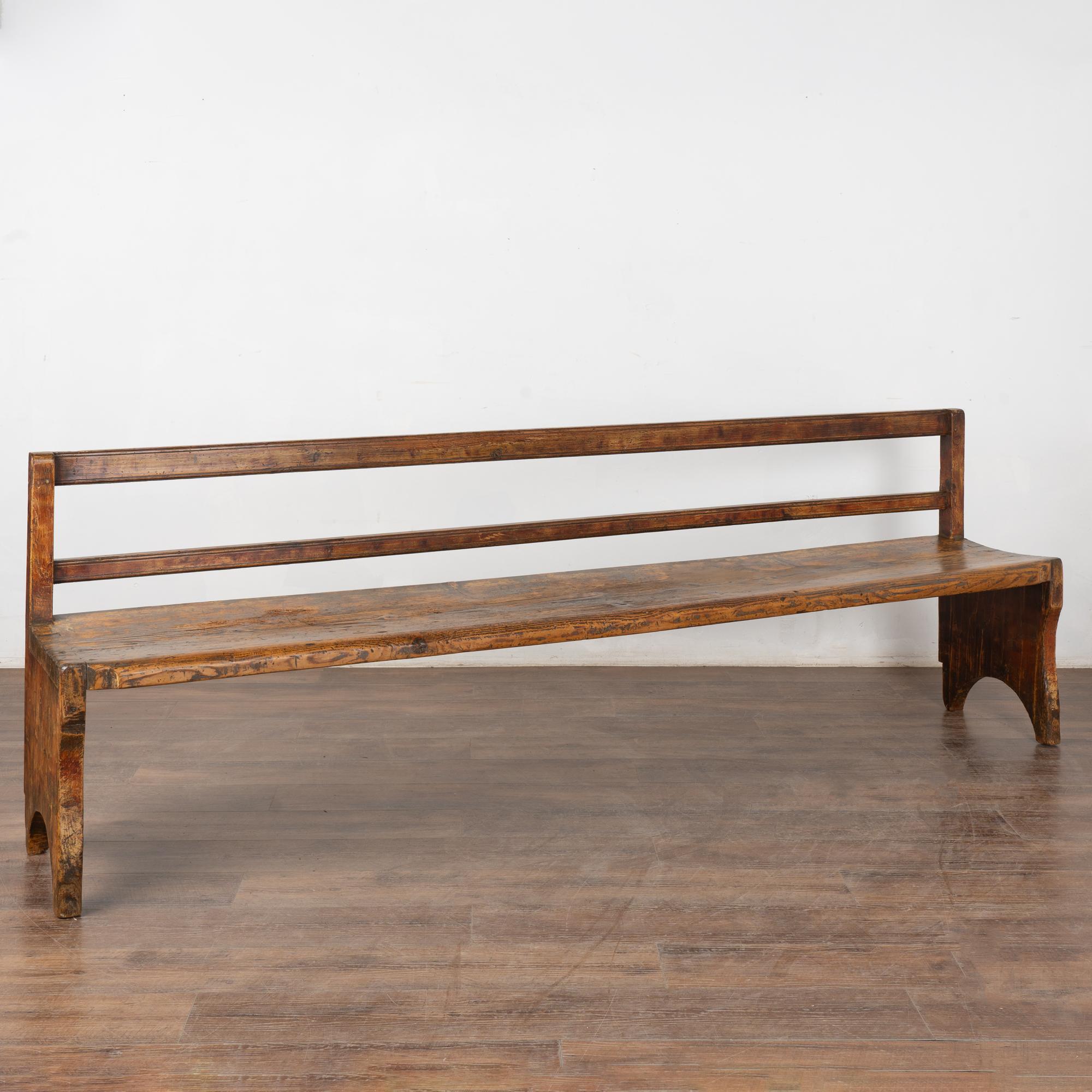 Rustic pine Swedish country bench loaded with soft weathered patina,  over 8' long.
Note the residual old red paint, stains, cracks that add to the depth of character in this long bench.
Restored, strong and level; wax finish. Ready to be used and