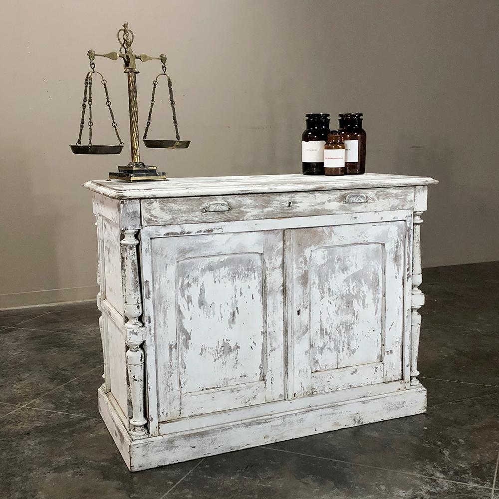 19th century rustic neoclassical painted store counter is the ideal choice for a kitchen island or workspace! The distressed, painted finish is also perfect for any casual décor,
circa 1890s
Measures: 36 H x 47 W x 24 D.