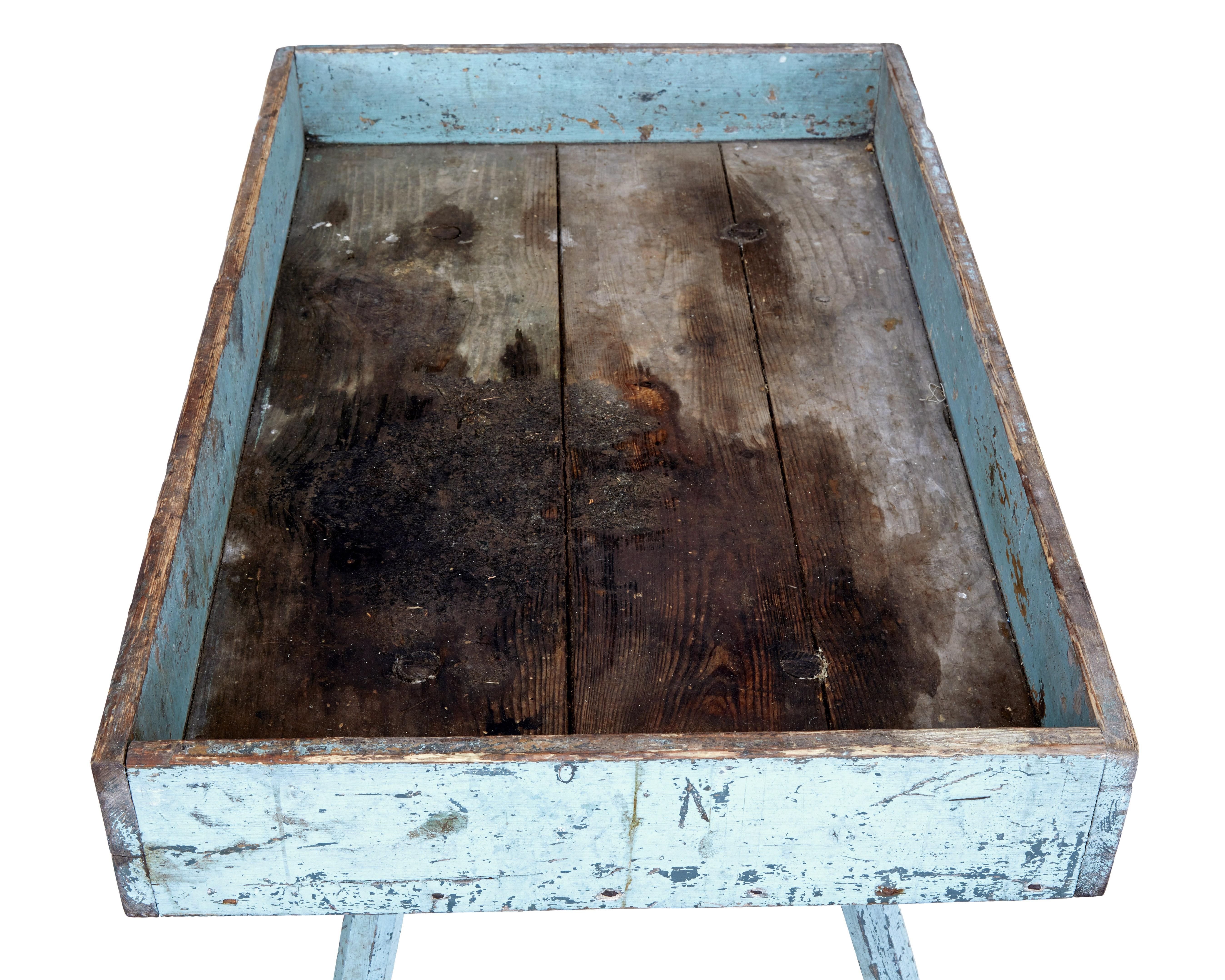 19th century rustic painted pine garden room tray table circa 1880.

Scandinavian rustic table made from pine presented in original condition.  The table surface could be cleaned to use in the home as a side table.

Original paint which is now