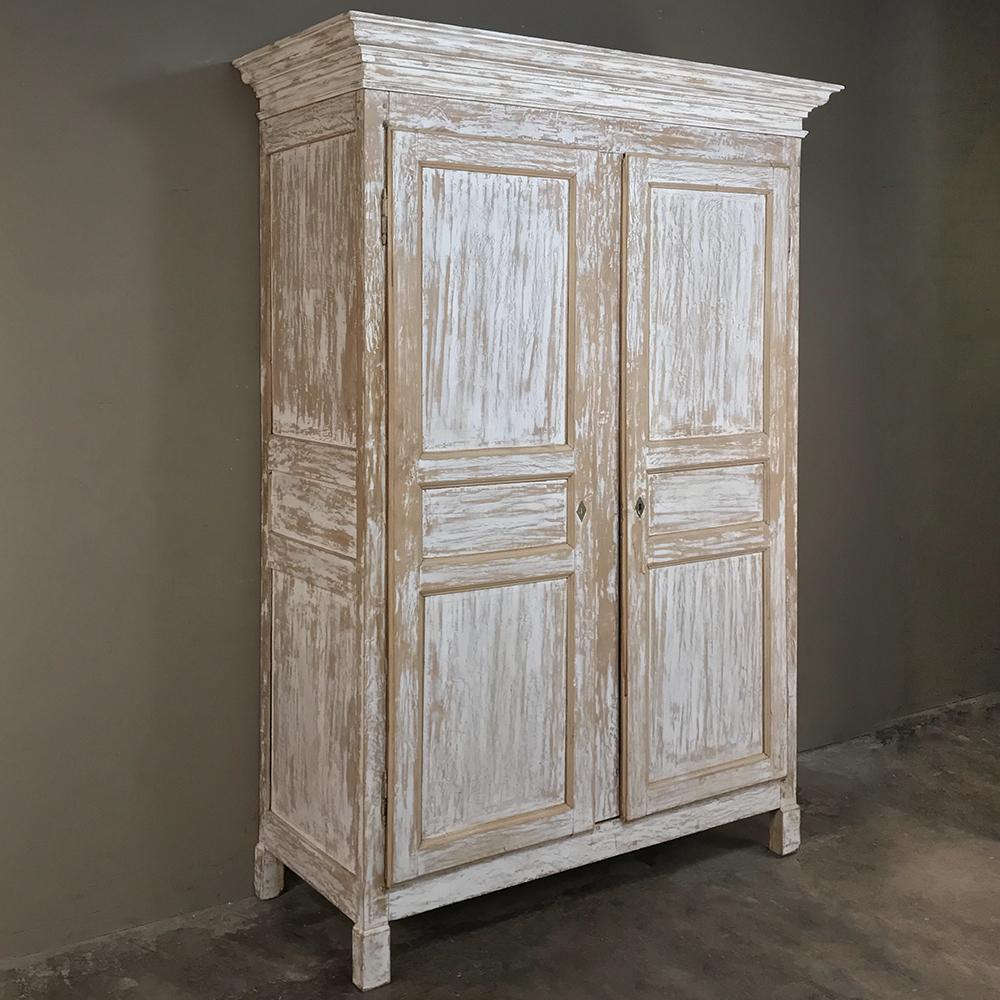 19th century rustic Swedish painted pine armoire exhibits a stately elegance that is enhanced by the patinaed distressed painted finish so in vogue today!
circa 1880s
Measures: 95 H x 62.5 W x 26.5D