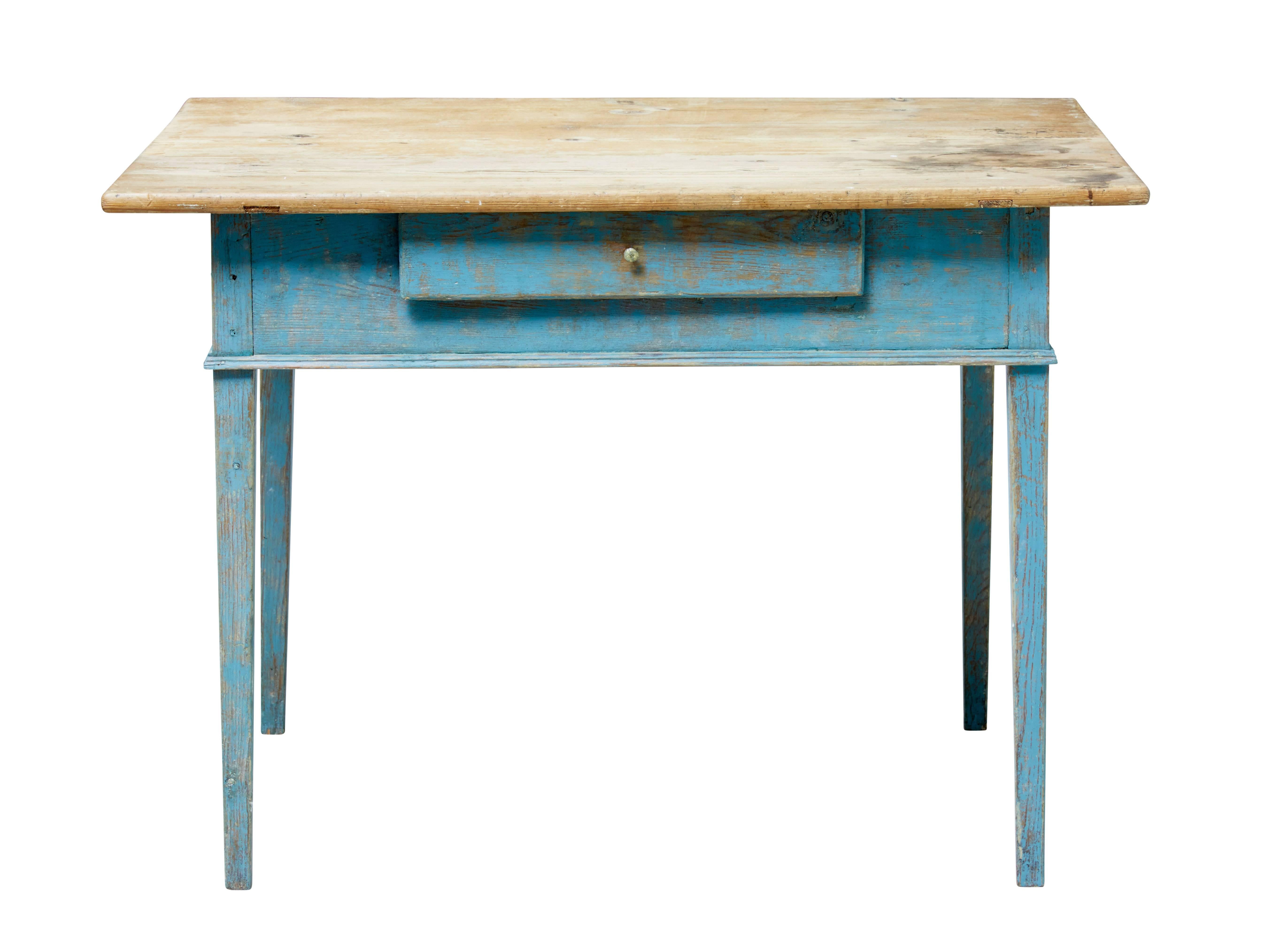 Rustic Swedish pine kitchen table, circa 1870.

Originally made as a kitchen table but also lends itself as a desk / work station.

Scrubbed pine top which is in original condition with surface staining, below which a painted base in contrasting