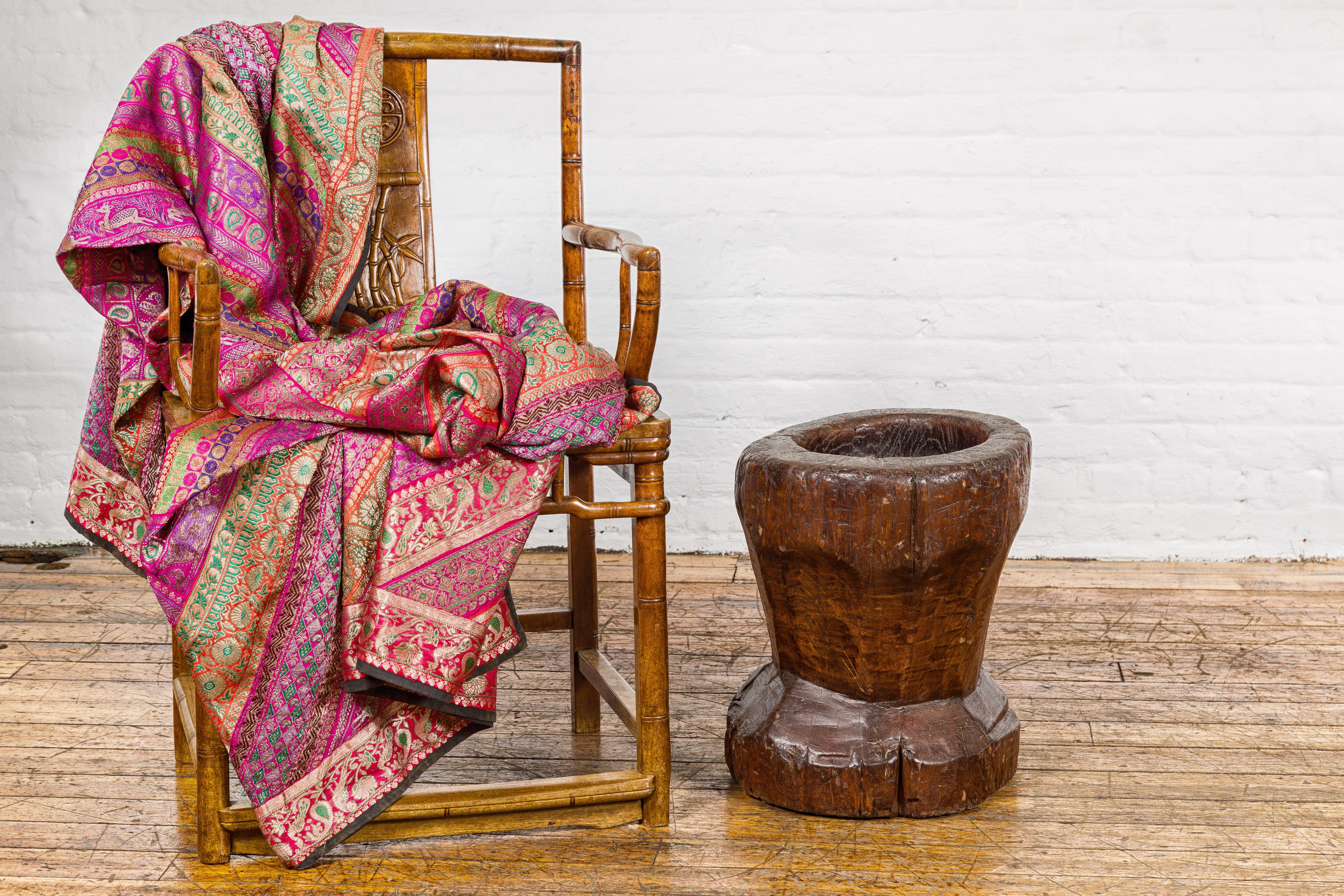 A 19th century rustic teak wood mortar urn, perfect to be used as an antique planter for a vintage home décor. This 19th-century rustic teak wood mortar urn is a testament to enduring craftsmanship and timeless appeal. Made from sturdy teak wood,