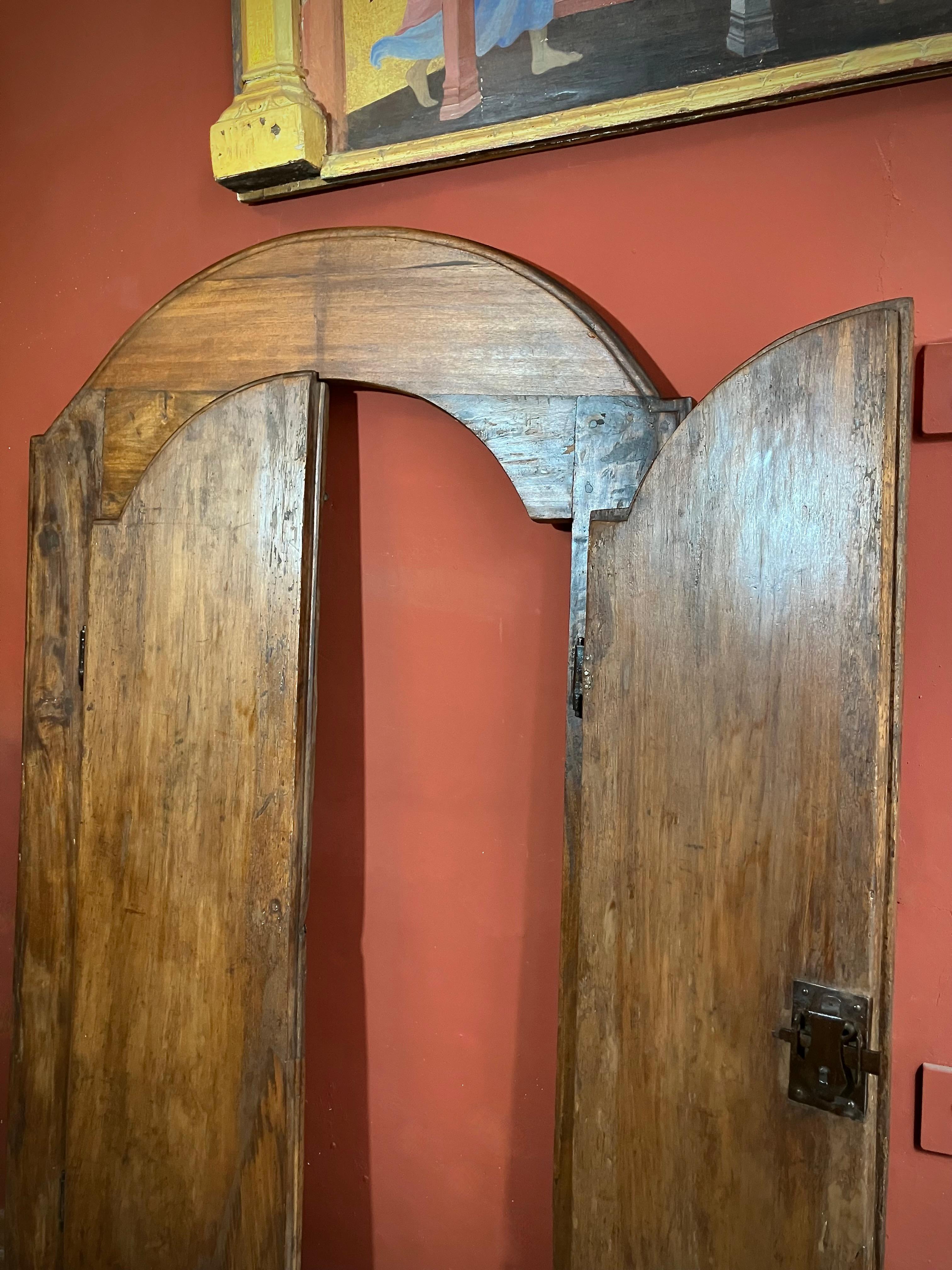 Authentic 19th-century Tuscan window in solid chestnut with original wrought iron fittings. A rare architectural salvage piece, ideal as a mirror, wall décor, or bespoke cabinet doors full of rustic Italian charm.
This rare 1800s Tuscan