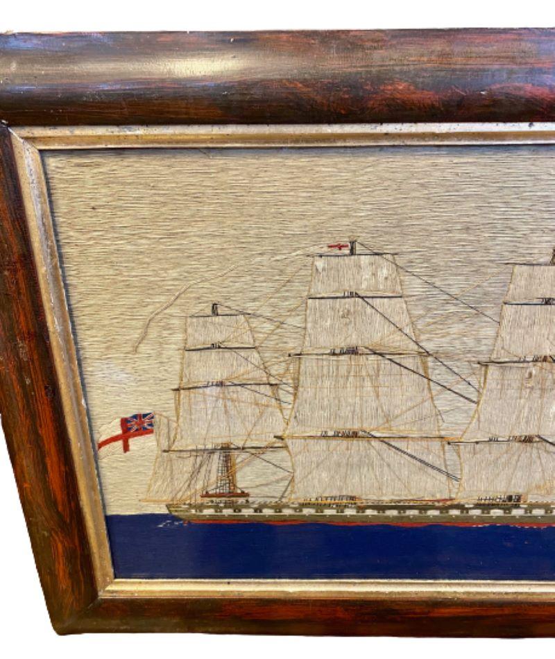 19th Century Sailor's Folk Art Woolie of a Square-Rigged Ship, circa 1850, a sailor's folk art hand stitched wool yarn picture of a British single decker Ship of the Line, flying the Ensign of the White Fleet off the spanker gaff, and an admiral's