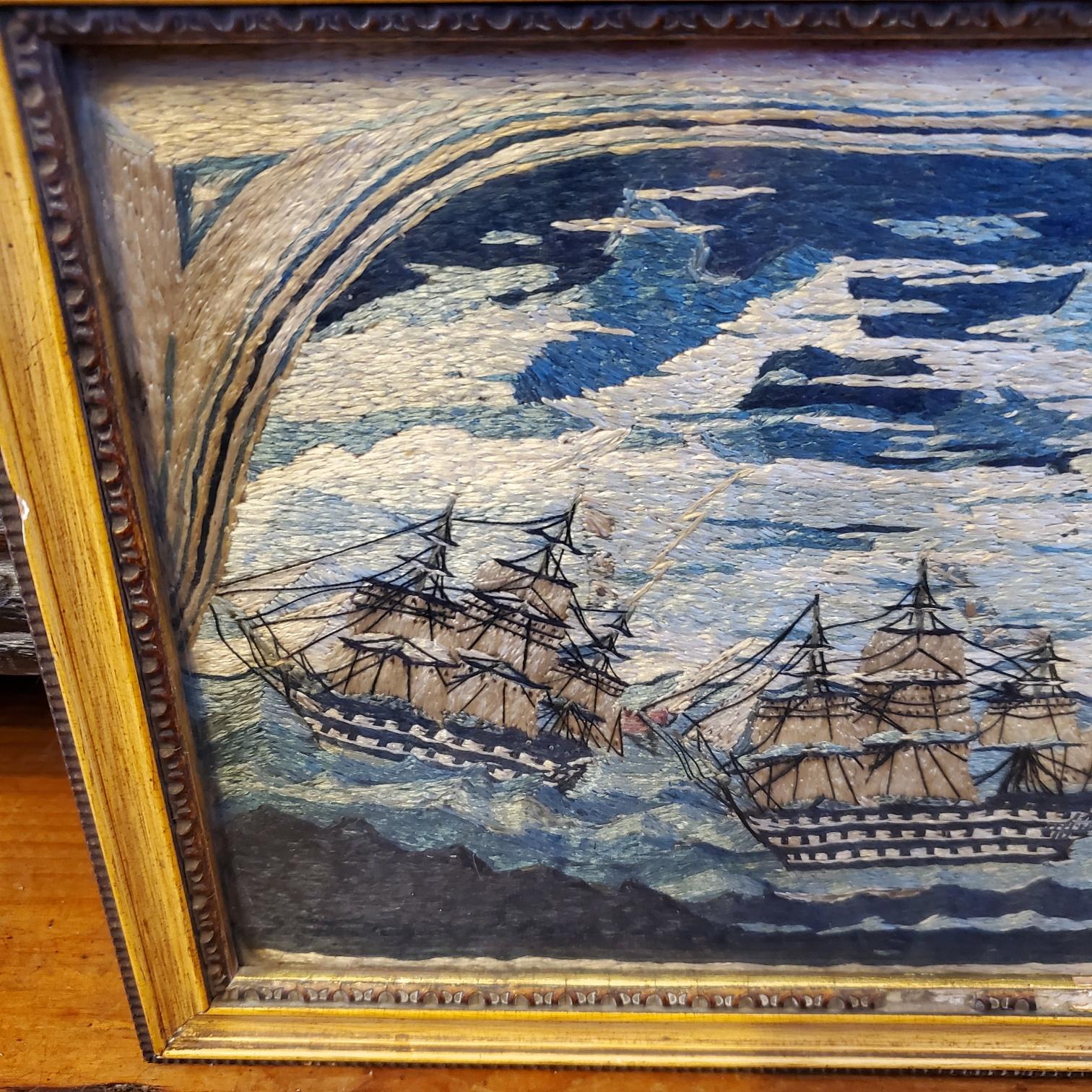 19th Century sailor's small woolie of three naval vessels, circa 1850, a small woolwork depicting three naval vessels: two Ships of The Line (a double decker and a triple decker) and a rarely seen Galleass (a warship nearly the size a corvette or a