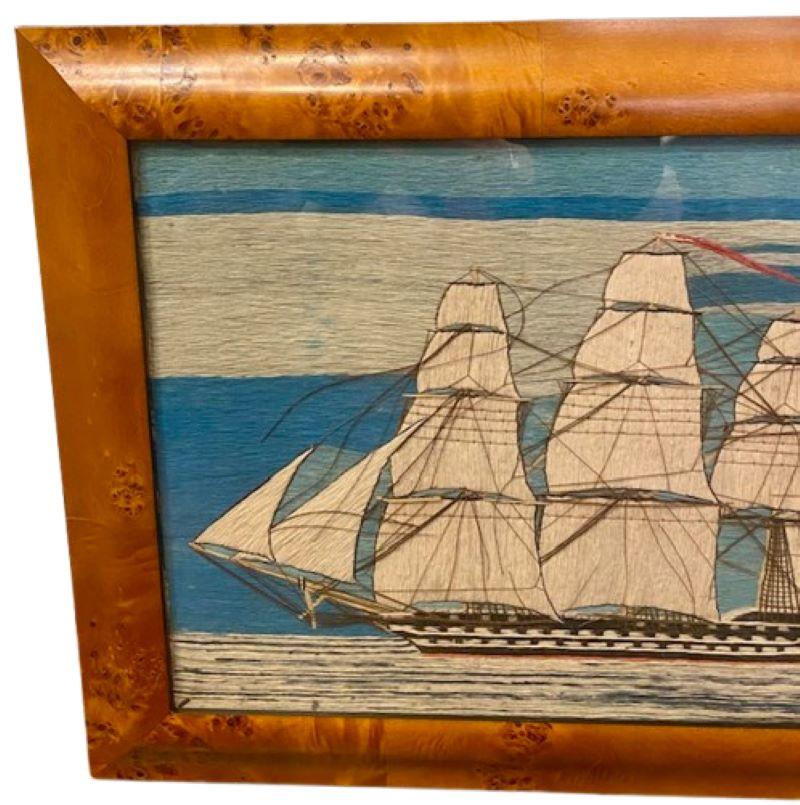 19th Century Sailor's Woolie of a Double Decker Ship of the Line, circa 1860, a sailor's hand stitched woolwork depicting a ship-rigged vessel under full sail, with two decks of gun ports, British red ensign flying off the spanker gaff, and long