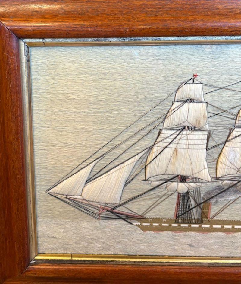 Lana de marinero del siglo XIX de una fragata de vapor británica, hacia 1850,  un cuadro de lana marinera hecho a mano, con una vista lateral a babor de una Fragata de Vapor Auxiliar de la Marina Británica a toda vela, con las velas de proa y mayor
