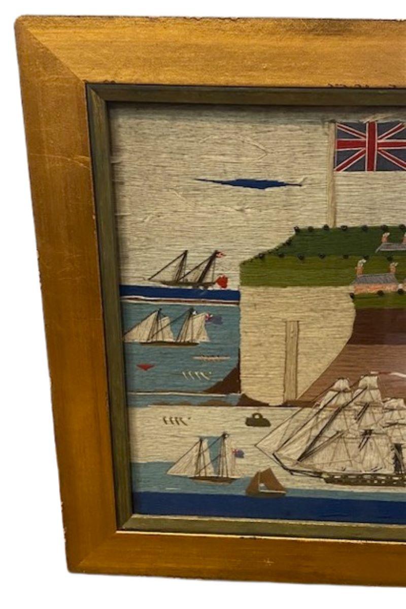 Sailor's Woolie of Canadian Fort del XIX secolo, circa 1860, un lavoro di lana folk art di un marinaio britannico che raffigura una flotta di vascelli e cannoniere di varie dimensioni e con diverse attrezzature che navigano intorno a una fortezza