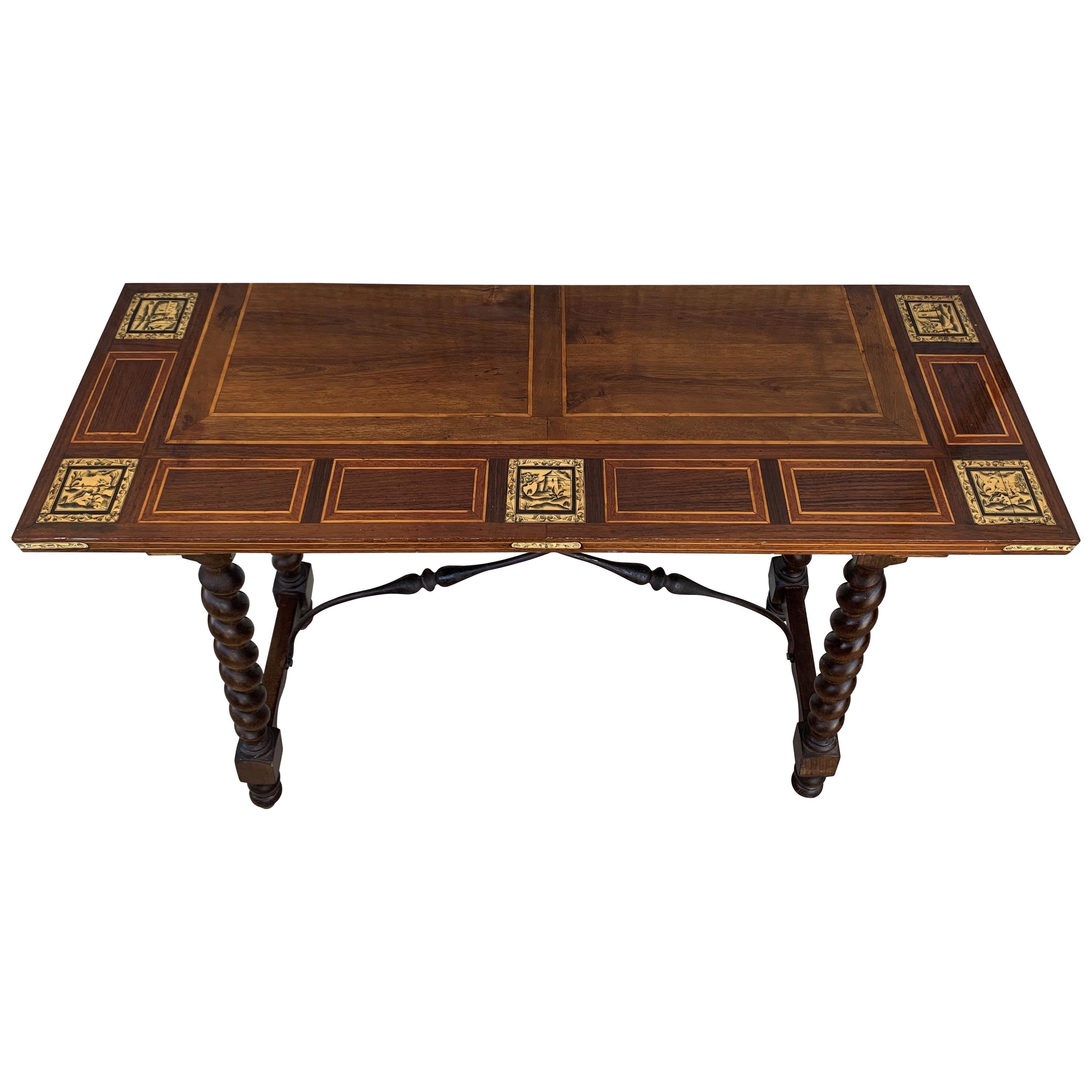 19th century Spanish salomonic Baroque side table with Marquetry top and iron stretchers
carved wooden table with smooth and rectangular upper board, which has two iron fasteners decorated with curves, and legs in turned wood, with salomonic shapes