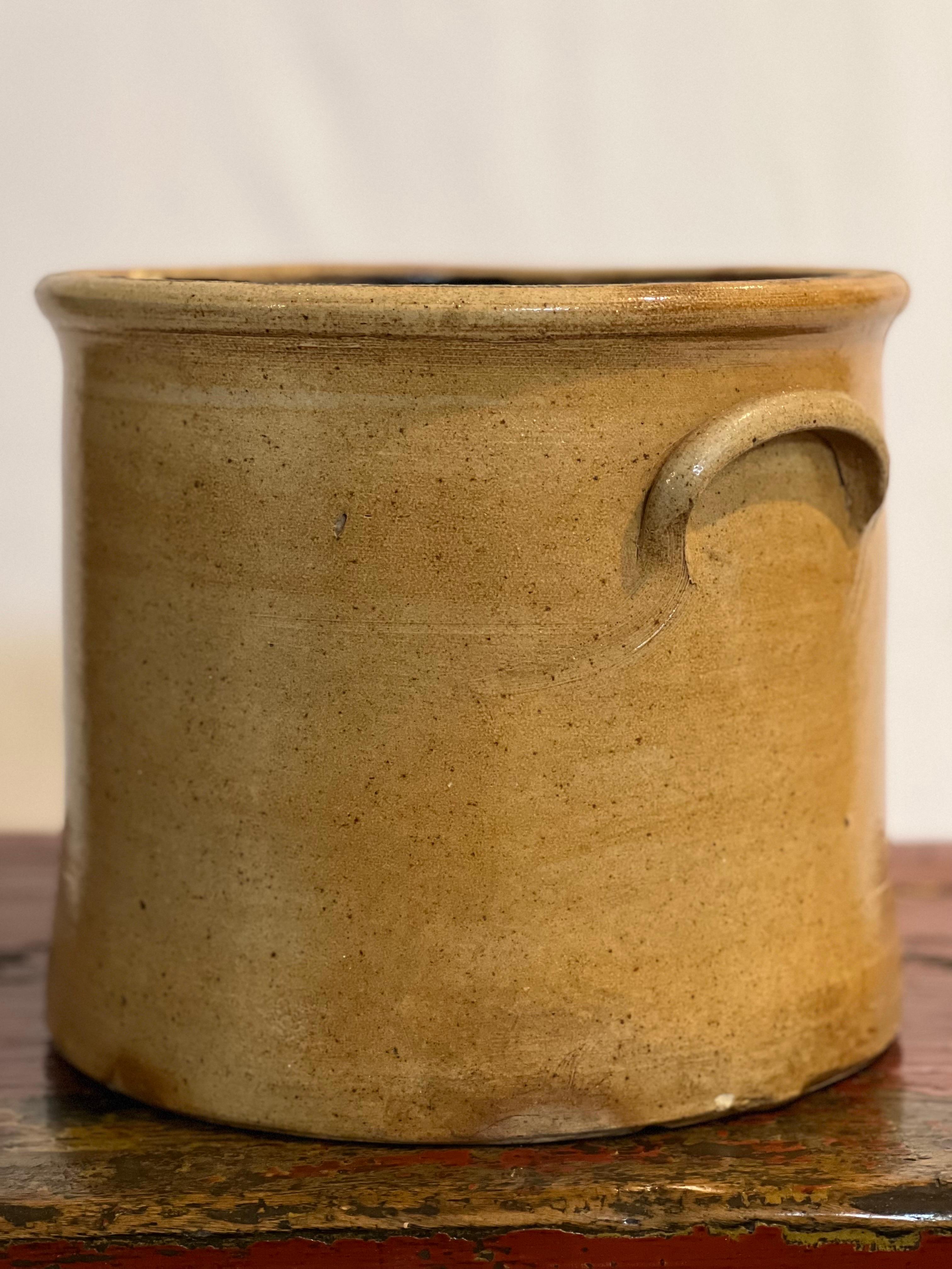 19th century two gallon salt glazed stoneware crock, circa 1860s.

In the style of H. Weston, the crock features a rounded rim, applied lug handles and cobalt blue floral/bee sting motif. A great size perfect for many uses and will add a touch of