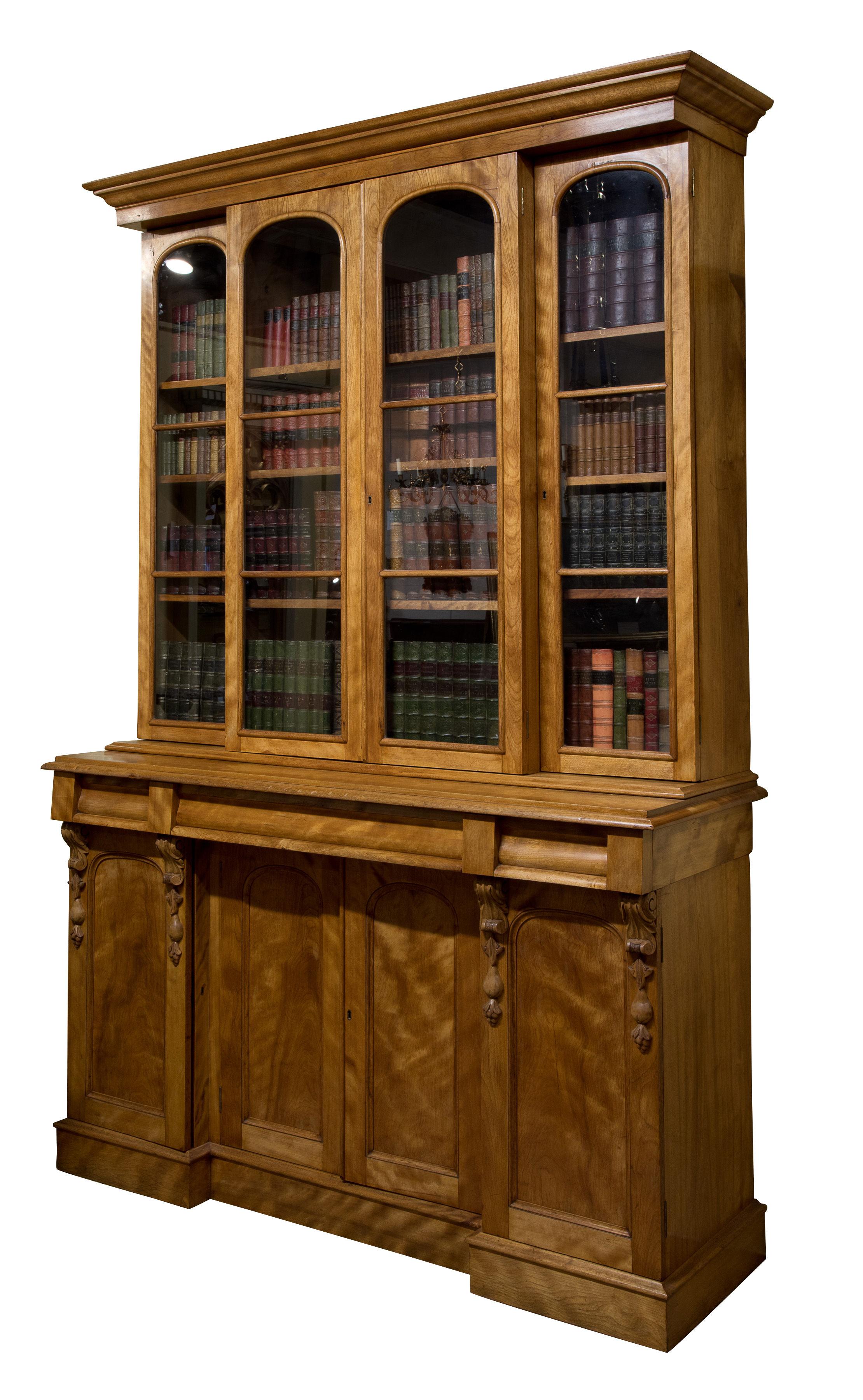 19th century satin walnut breakfront bookcase with 4 glazed doors and 4 paneled doors. Molded drawers,

circa 1850.