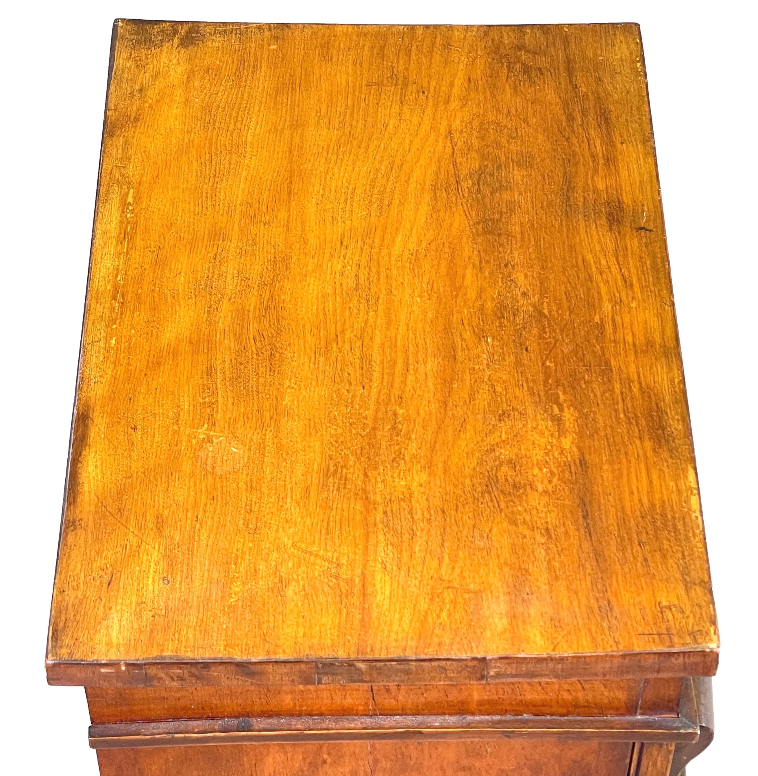 A very good quality mid 19th century Satinbirch wood, childs size wellington chest, having eight drawers with original turned wooden knobs, enclosed by Locking Pilaster.

Childs size examples of the typical wellington chest of drawers are
